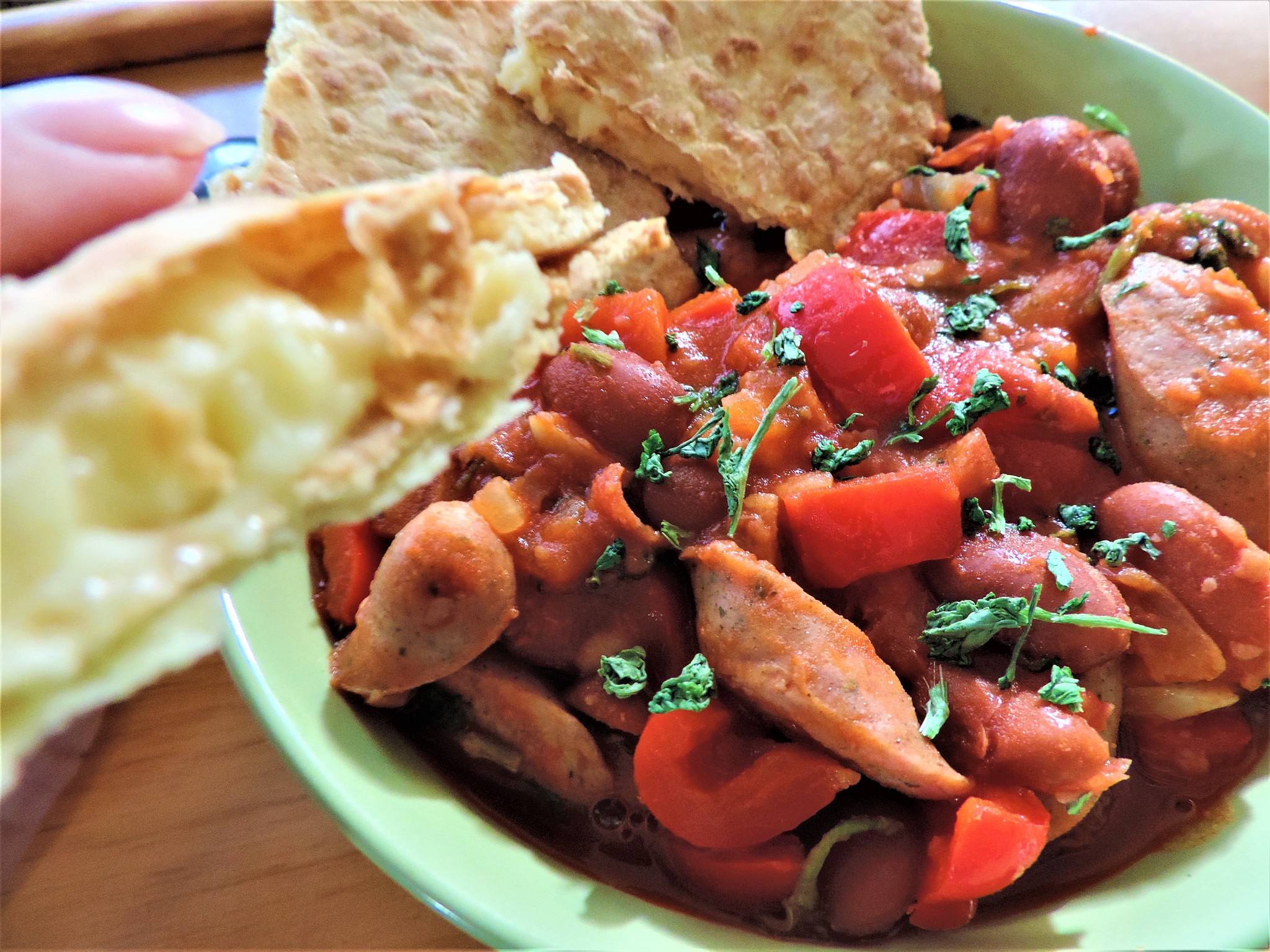 mexican style red beans with sausages, red bell peppers, and toa