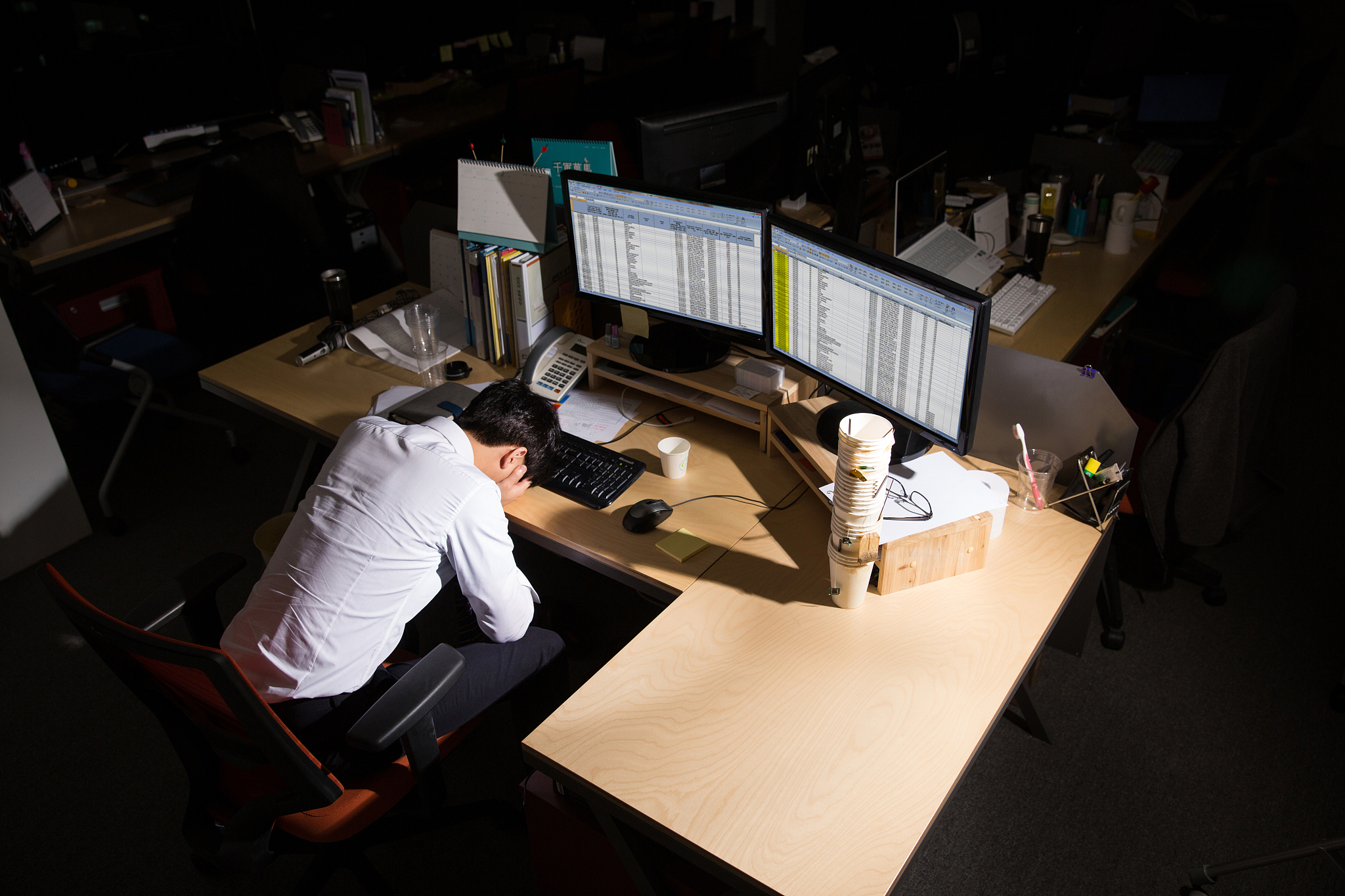 a businessman sleeping at a company
