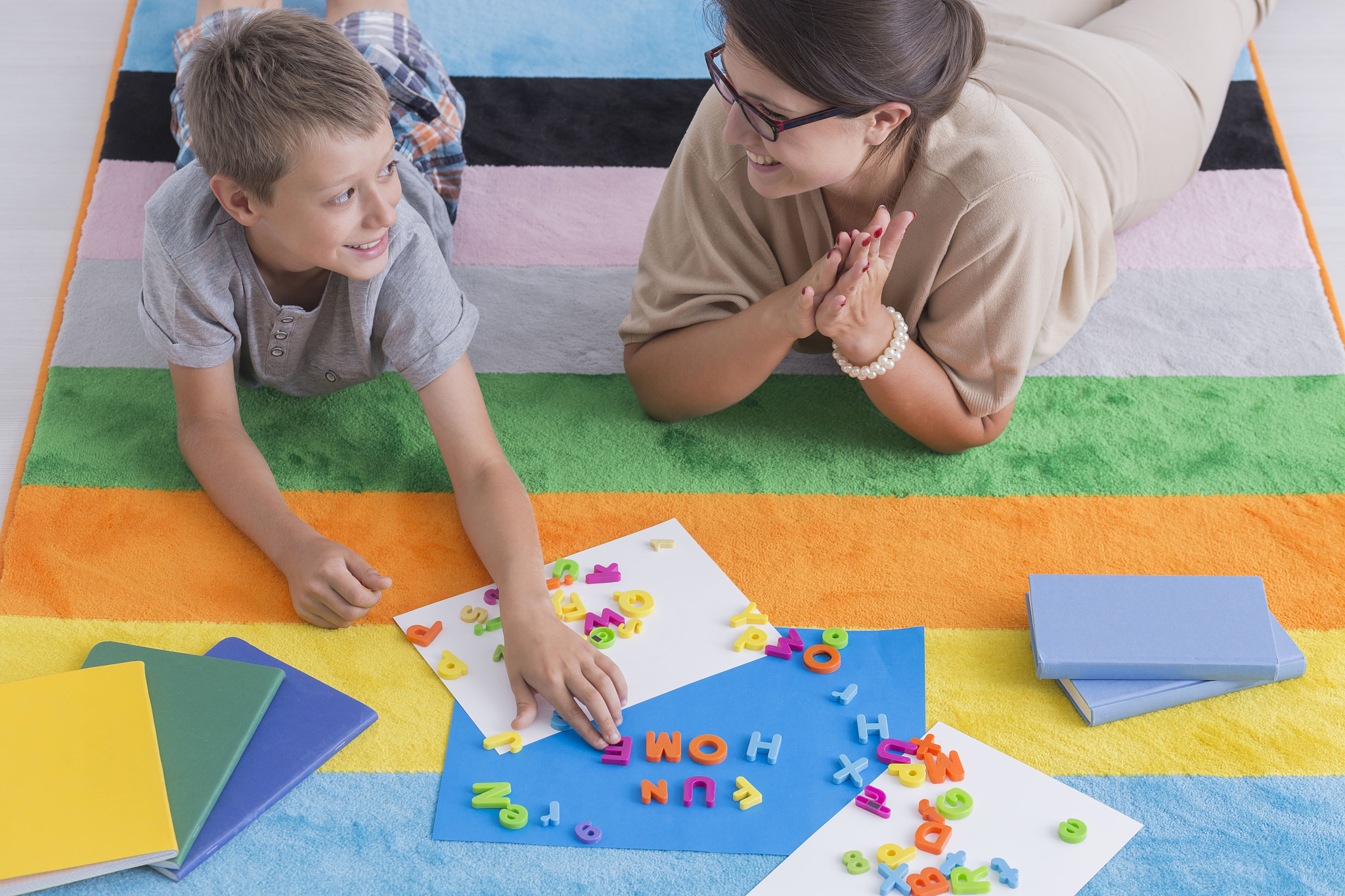 smiling teacher and child