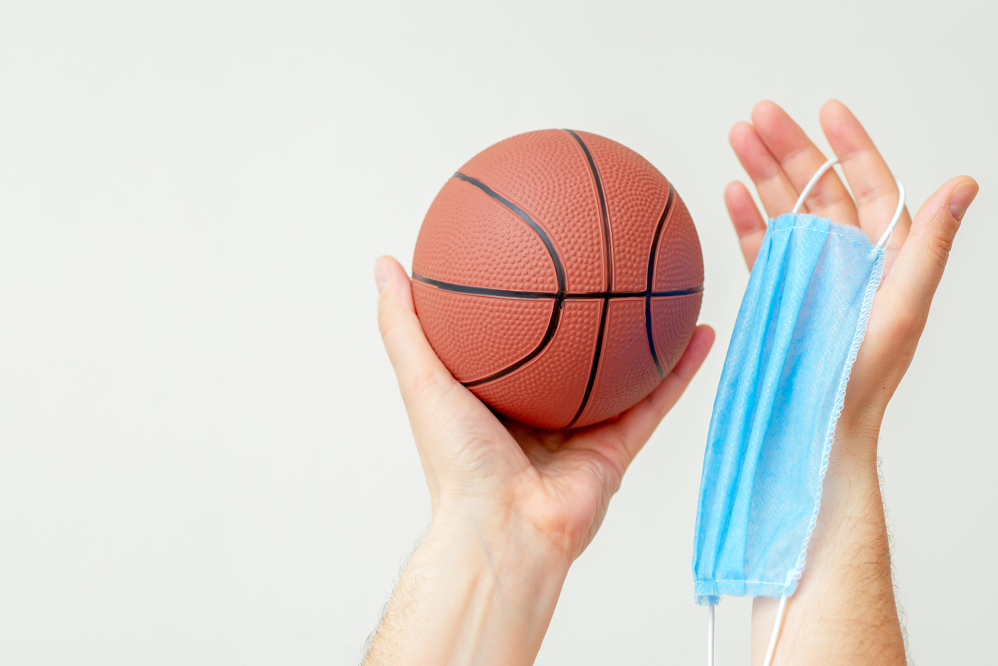 basketball ball with medical mask.