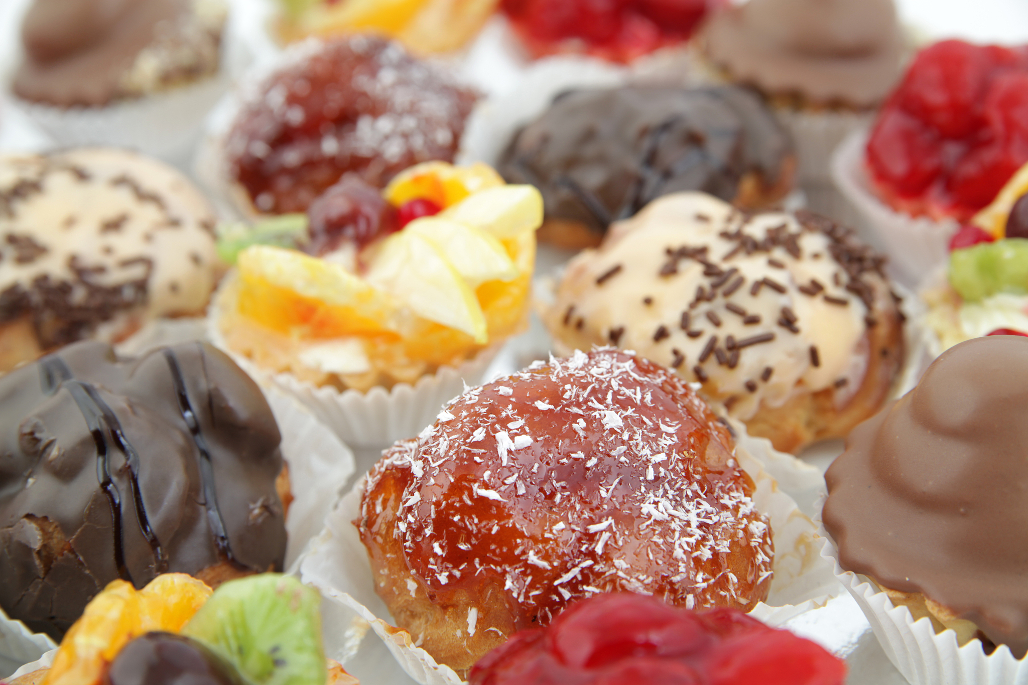 close up of small cakes with different stuffing
