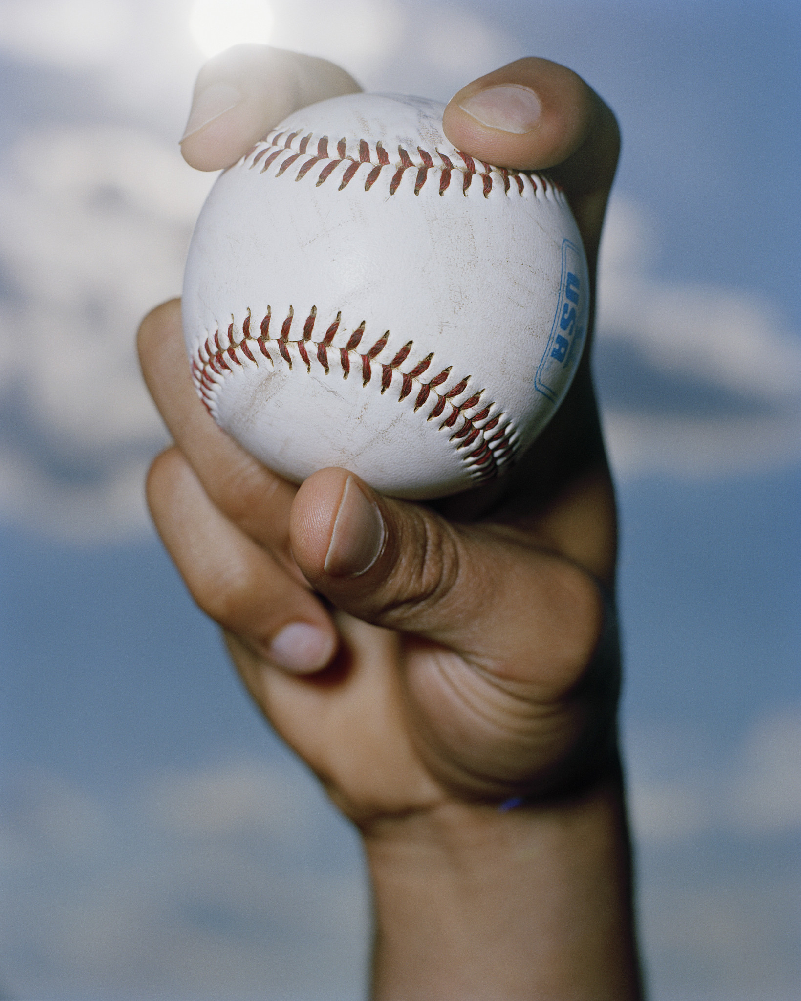 hand holding baseball