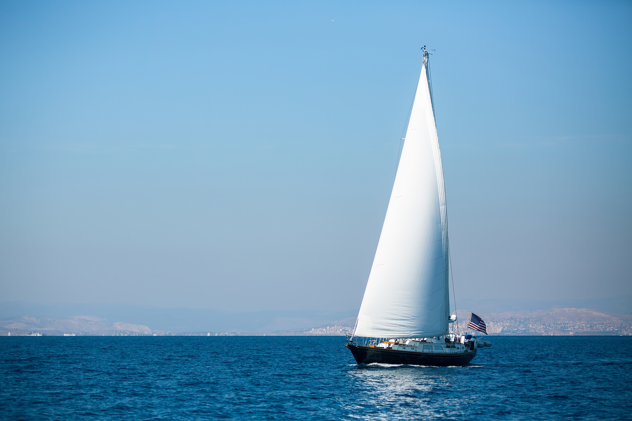 sailing in the wind through the waves at the sea. luxury yachts.