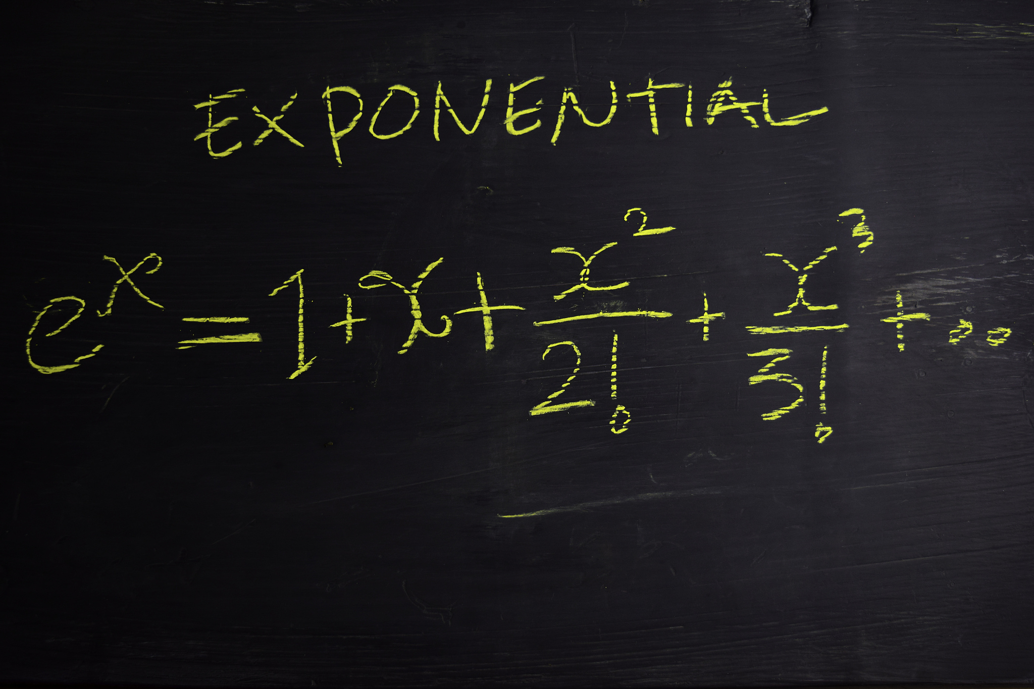 close up math formulas written on a blackboard. education concep