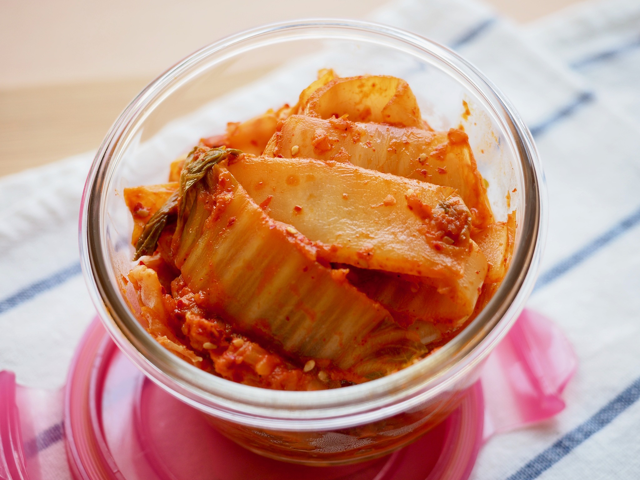 korean traditional food, stir-fried kimchi in a glass container