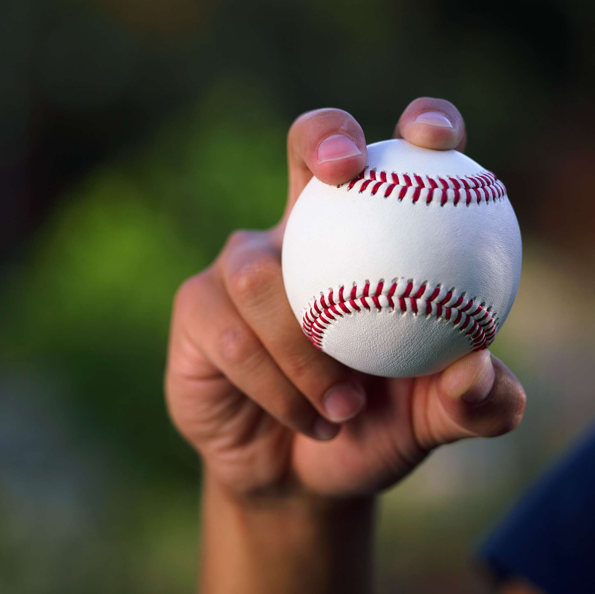 hand holding baseball
