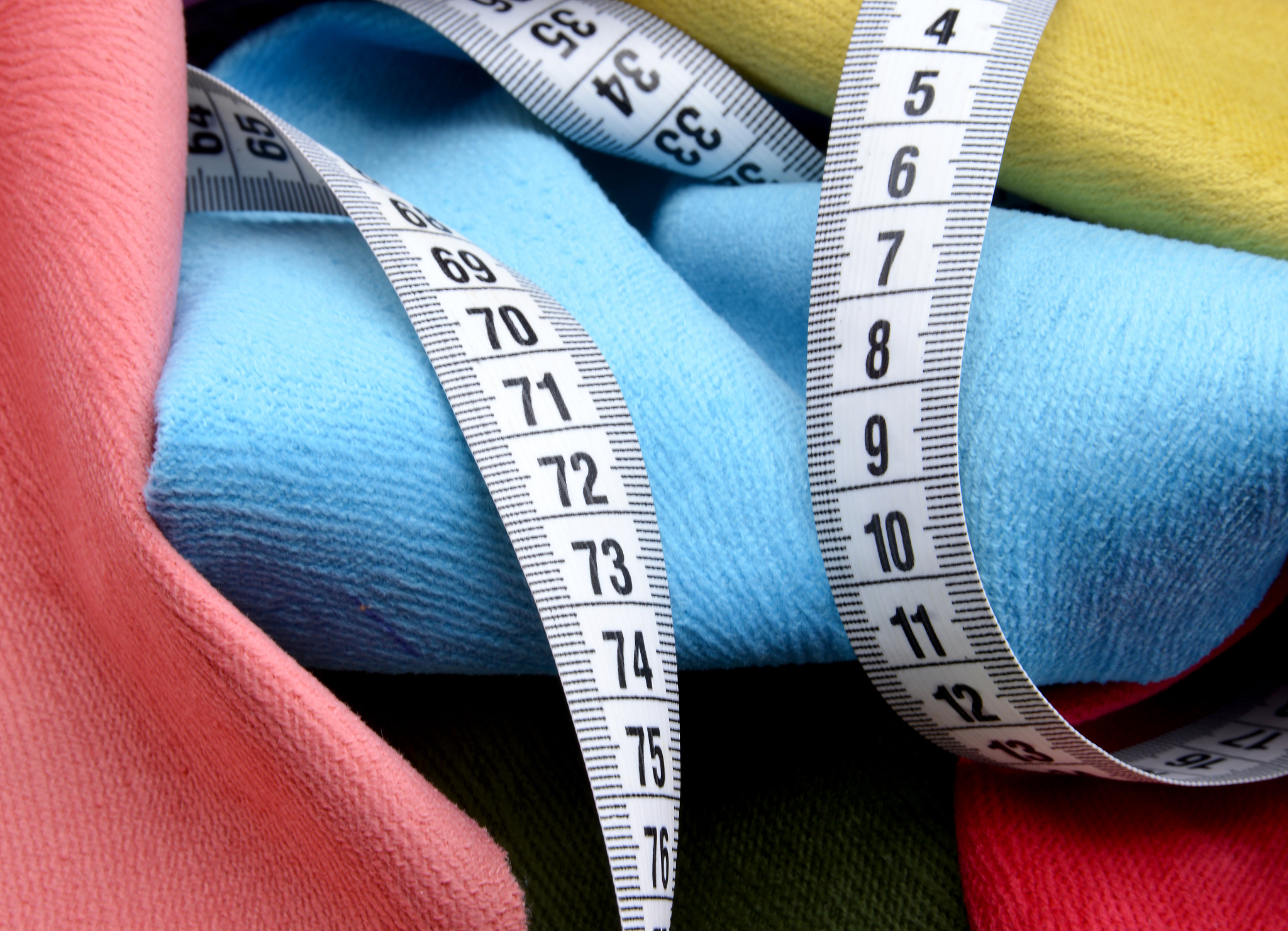 measuring tape on fabric background