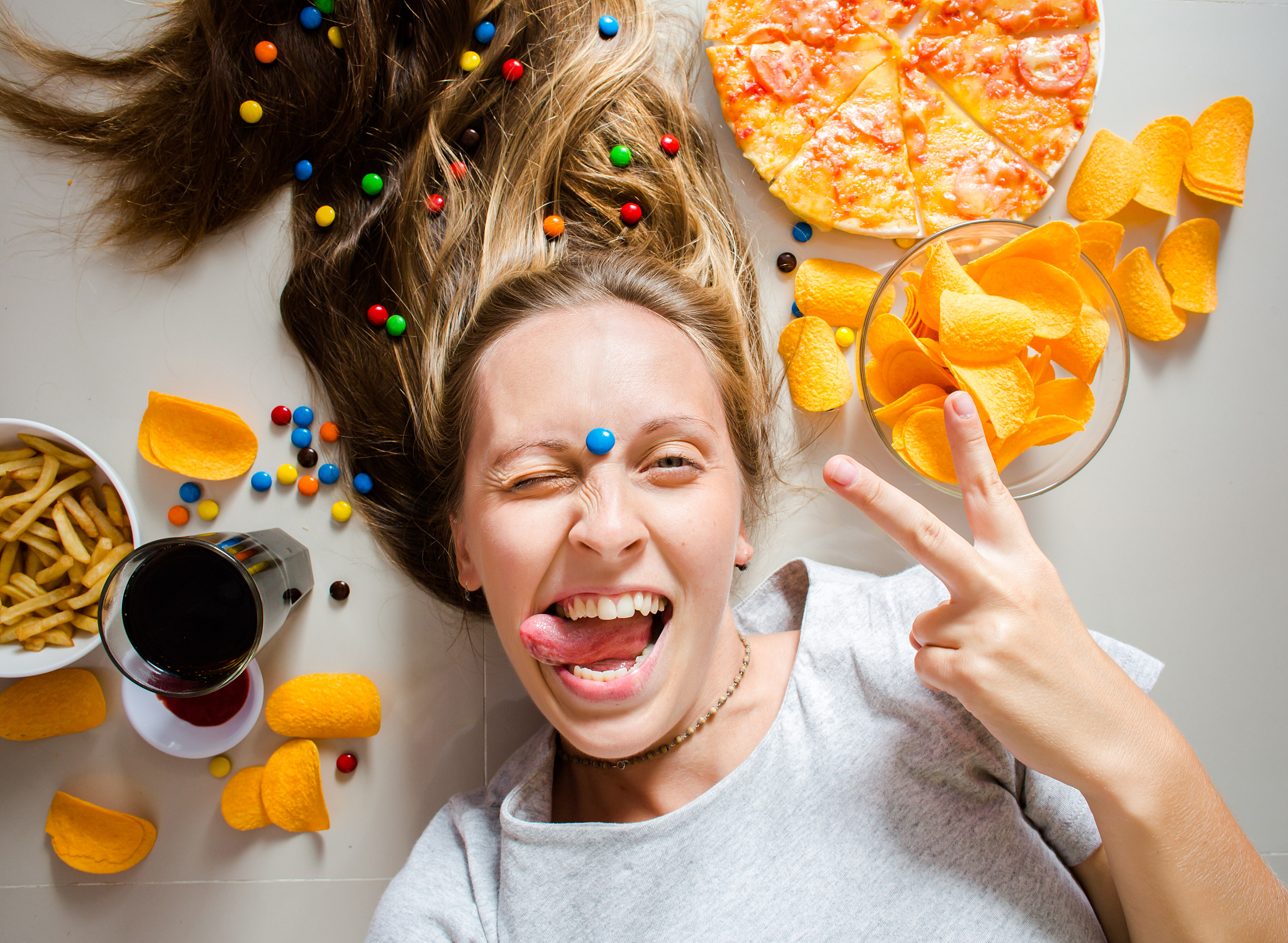 unhealthy concept. woman with unhealthy food