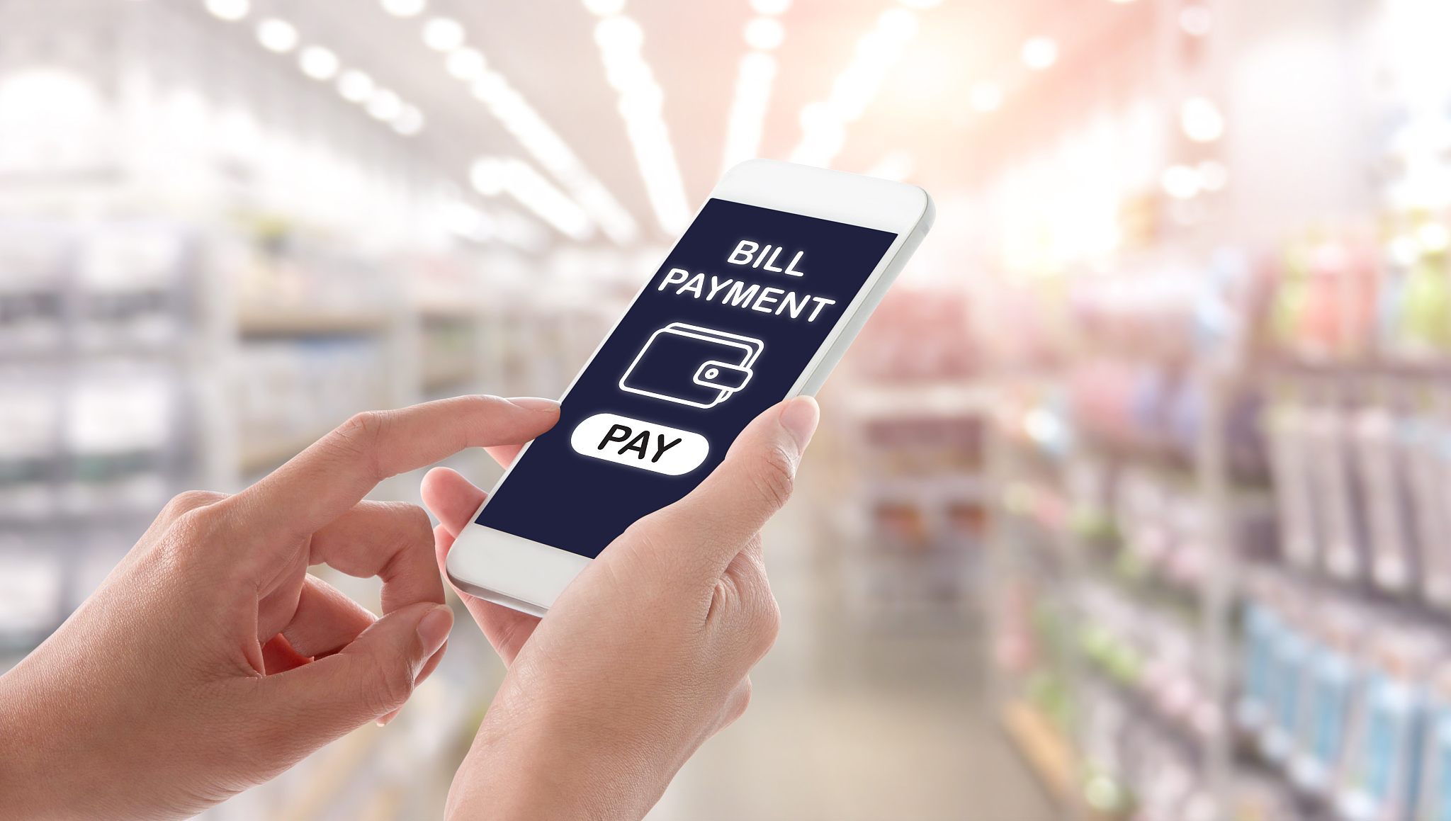 woman hands holding and using smartphone with bill payment scree