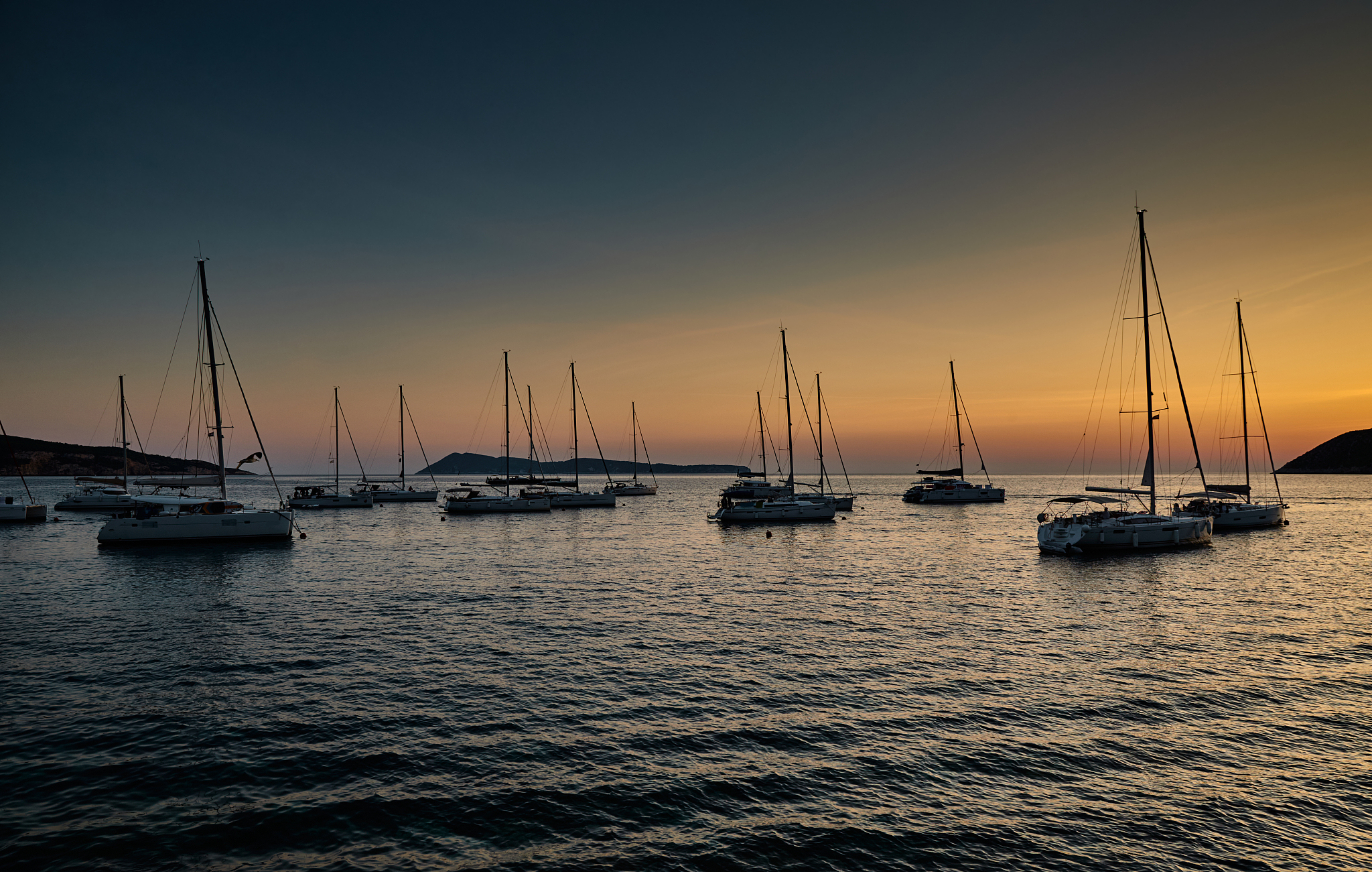 parking of sailboats at marina in croatia at sunset, the picture