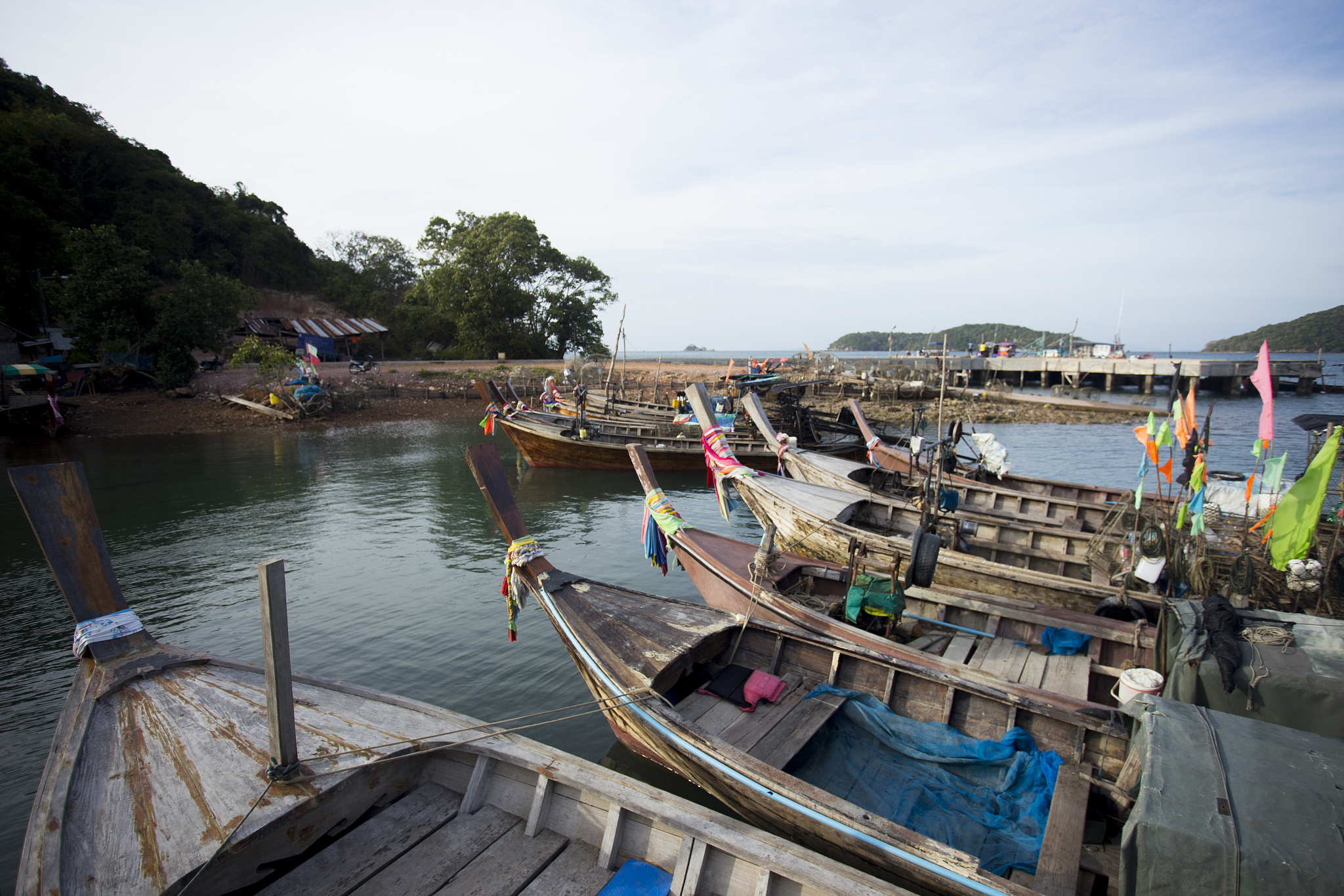 long tail boats in a fishermen village in thailand.
