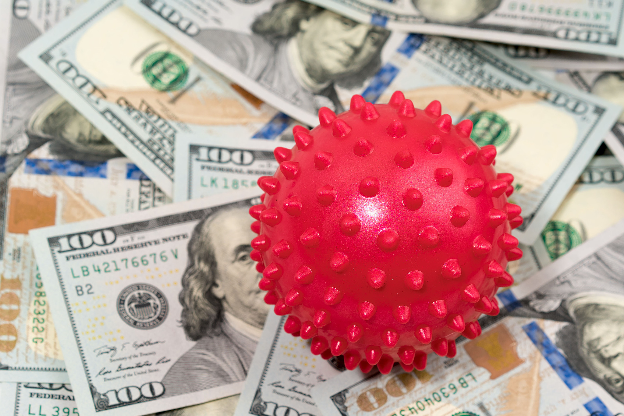 coronavirus model on the background of hundred-dollar american b