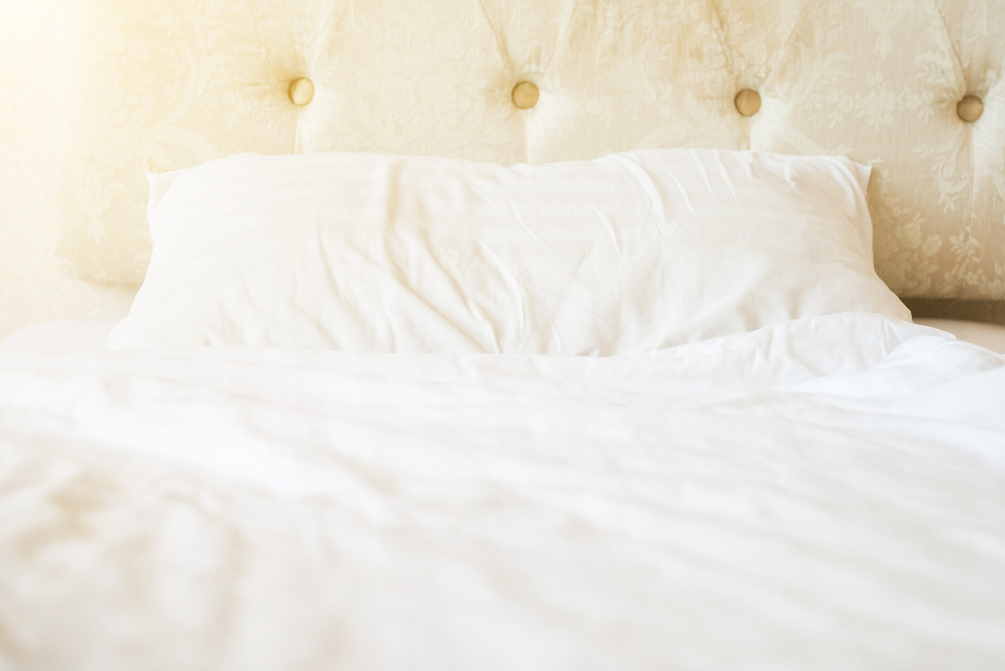 mattresses and pillows on the luxury bed in the hotel room after