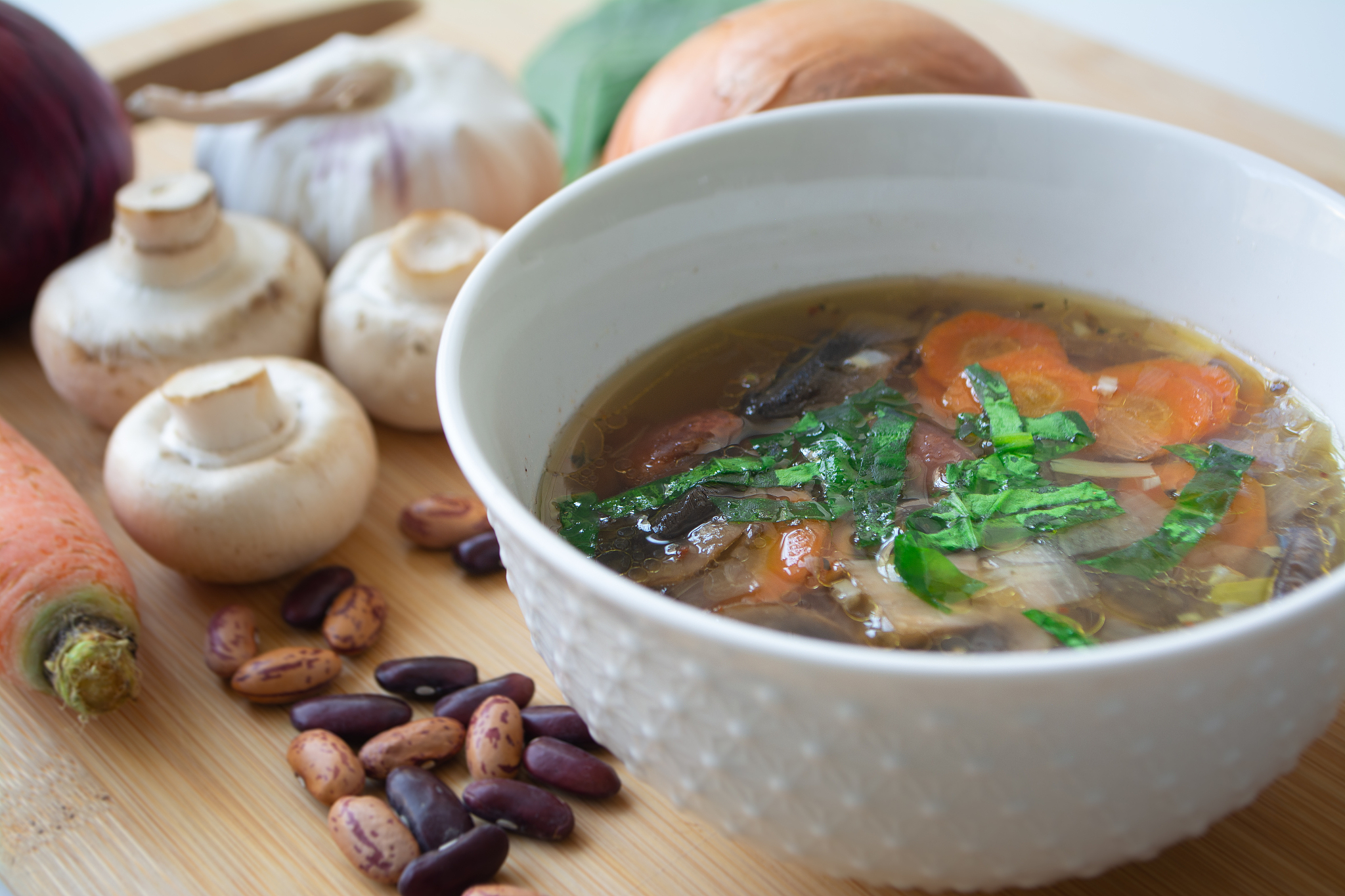 vegan soup with vegetables, mushrooms and beans