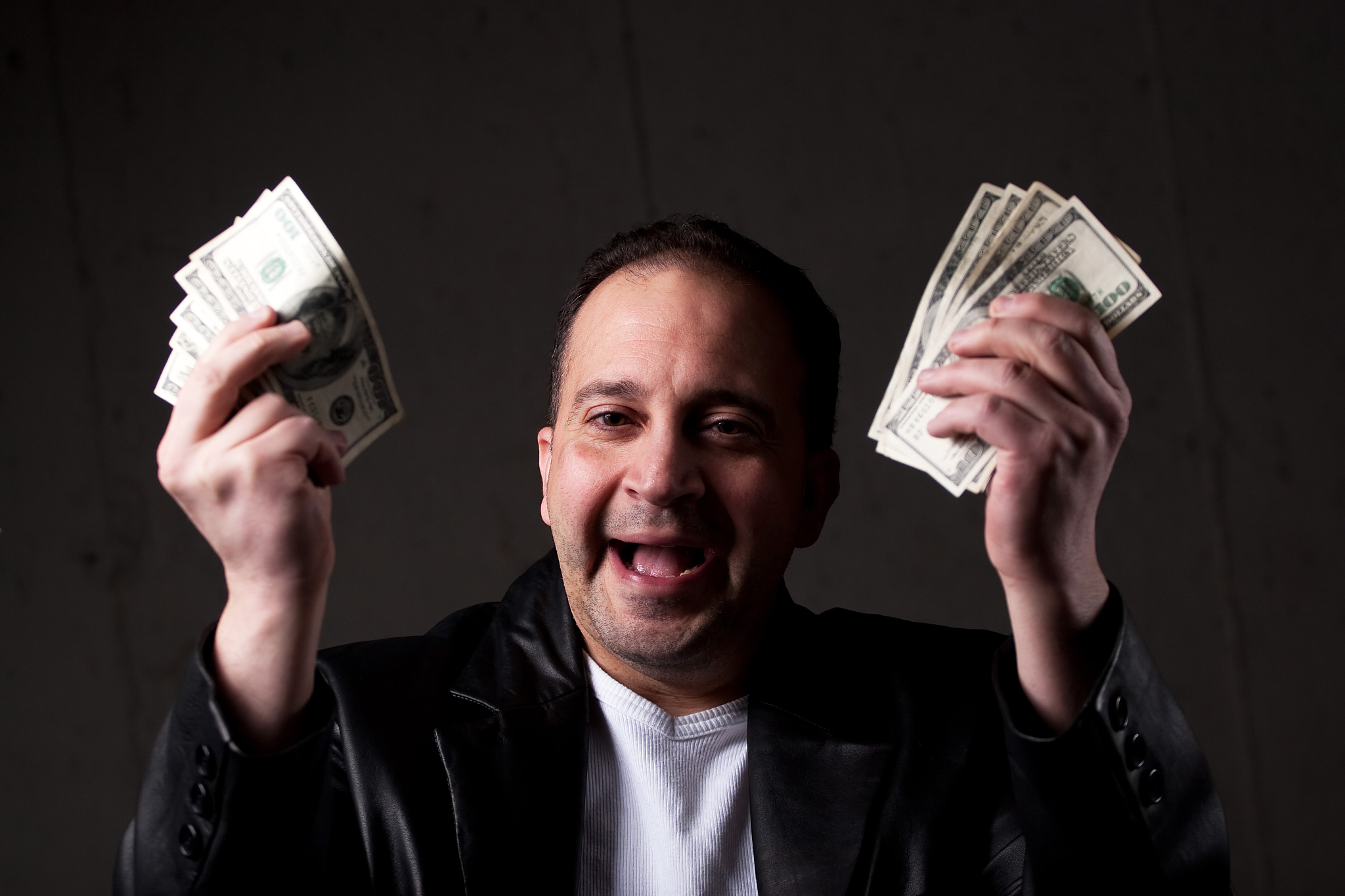 man holding out money