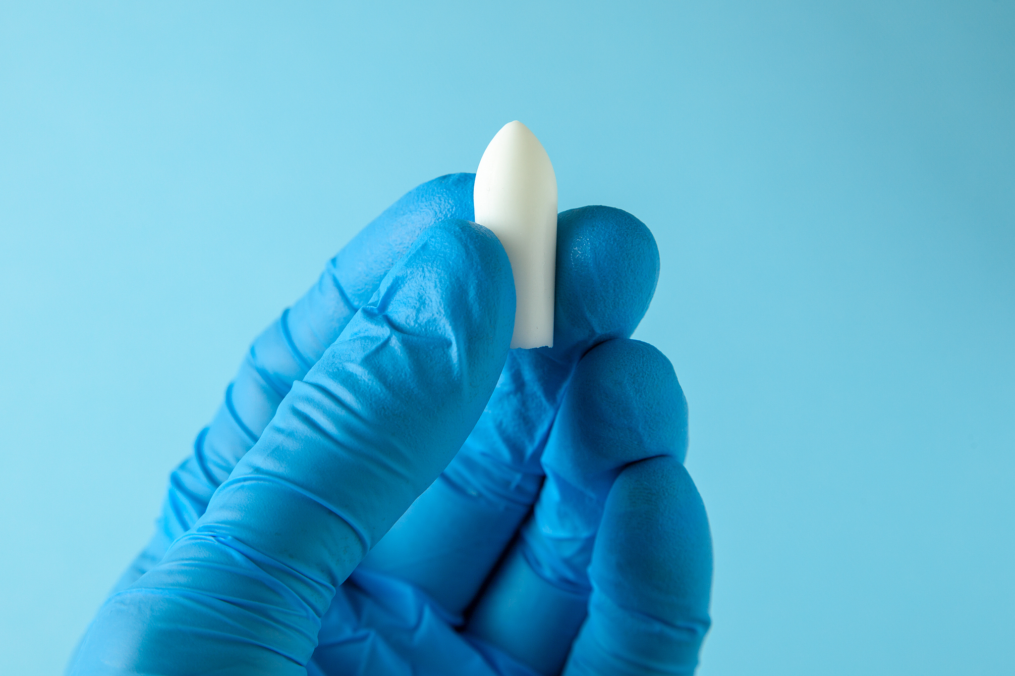 suppository for anal or vaginal use in the hands of doctor in gl