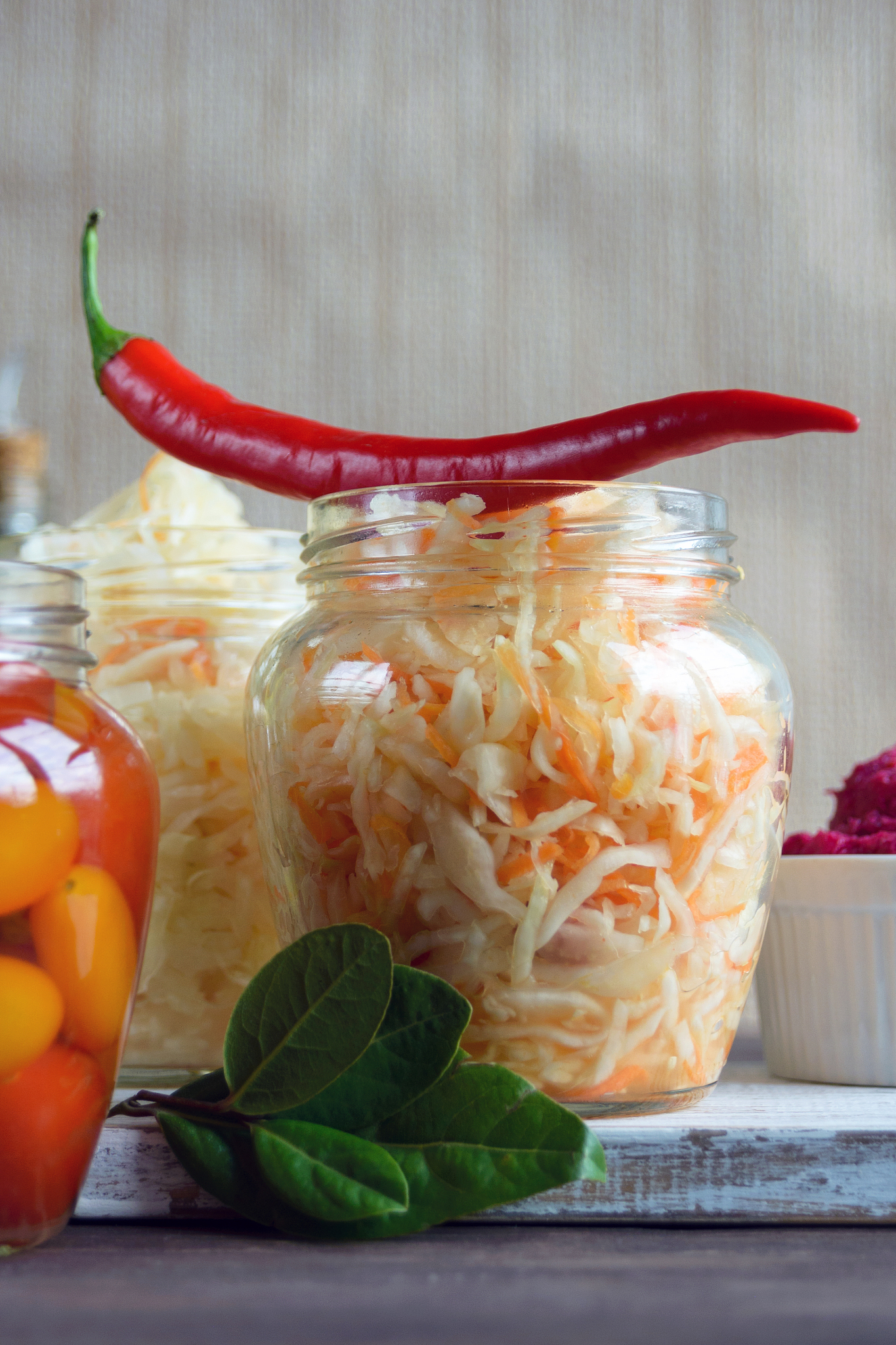 fermented foods. sauerkraut in a glass jar on a white background