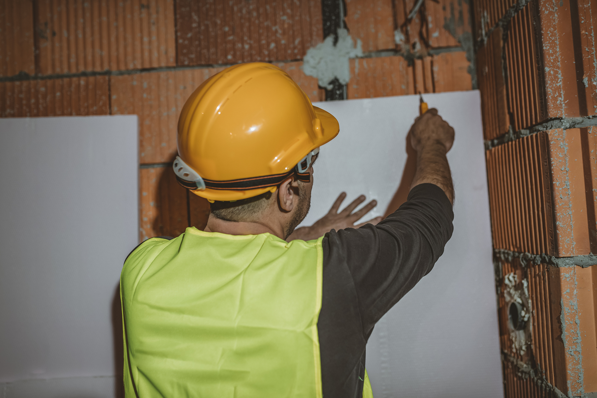 maintenance engineer is working inside the building site