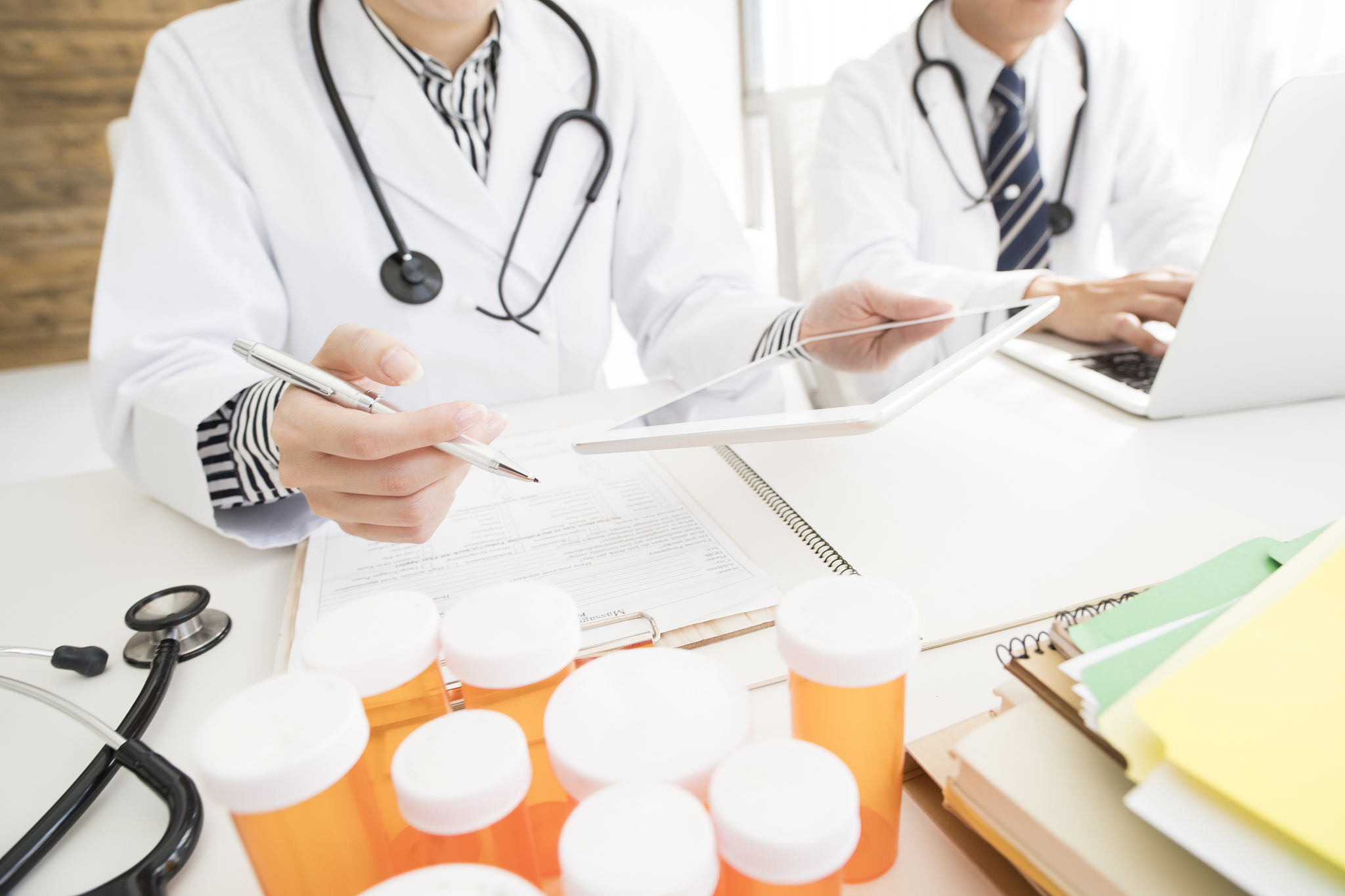 men and women in white coats to work