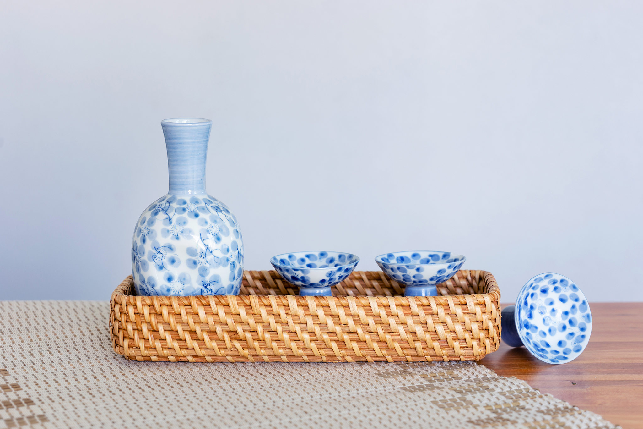 close up of japanese sake drinking set on a white background.