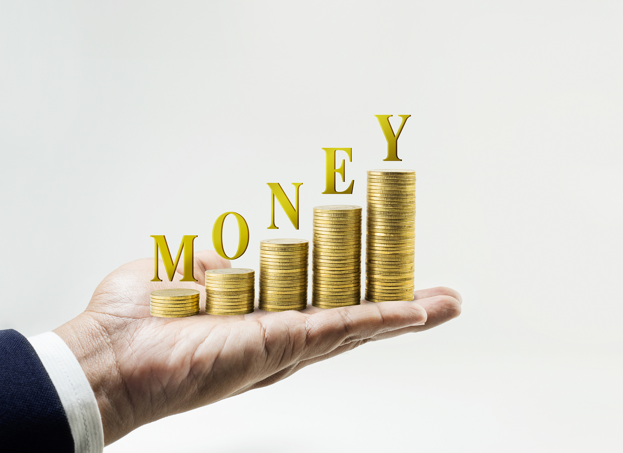 money word with money coin stacked growing on businessman hand.f