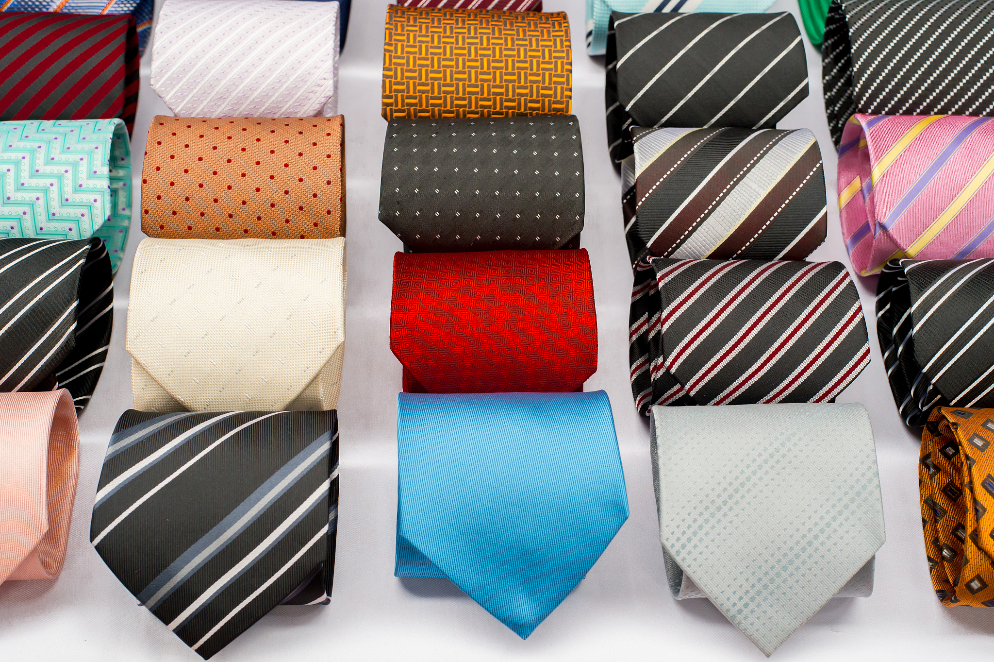 set of rolled up neck ties