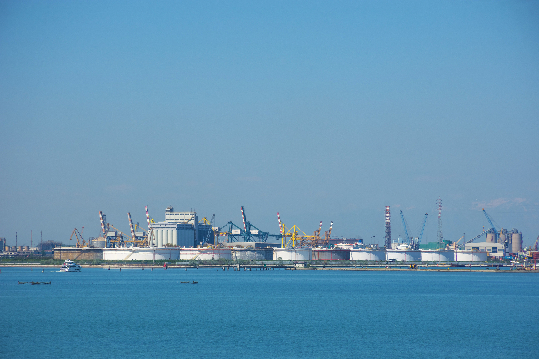 view of the industrial area and shipping port in venice, italy.