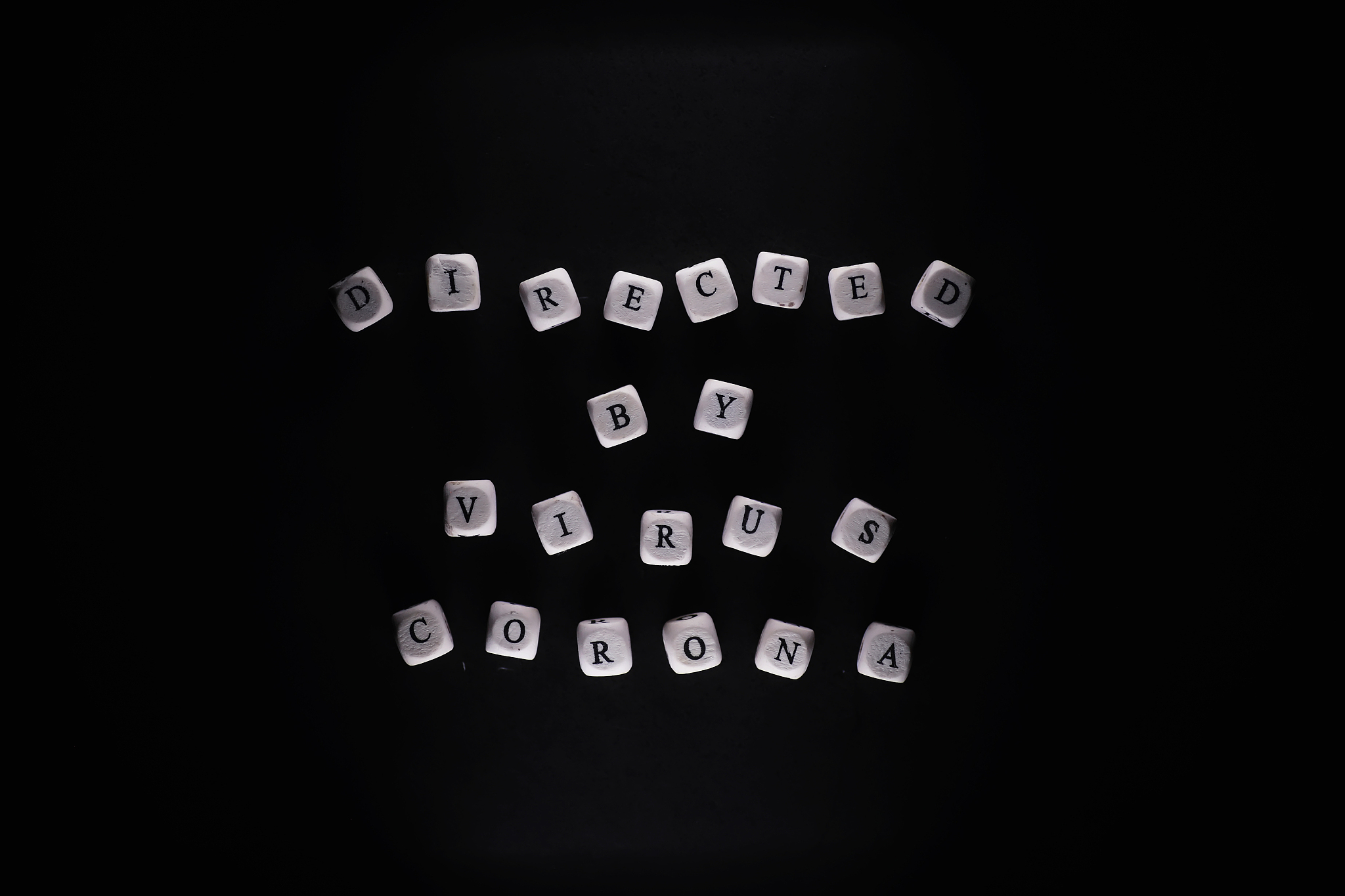 small letters cubes the inscription "virus". on a dark backgroun