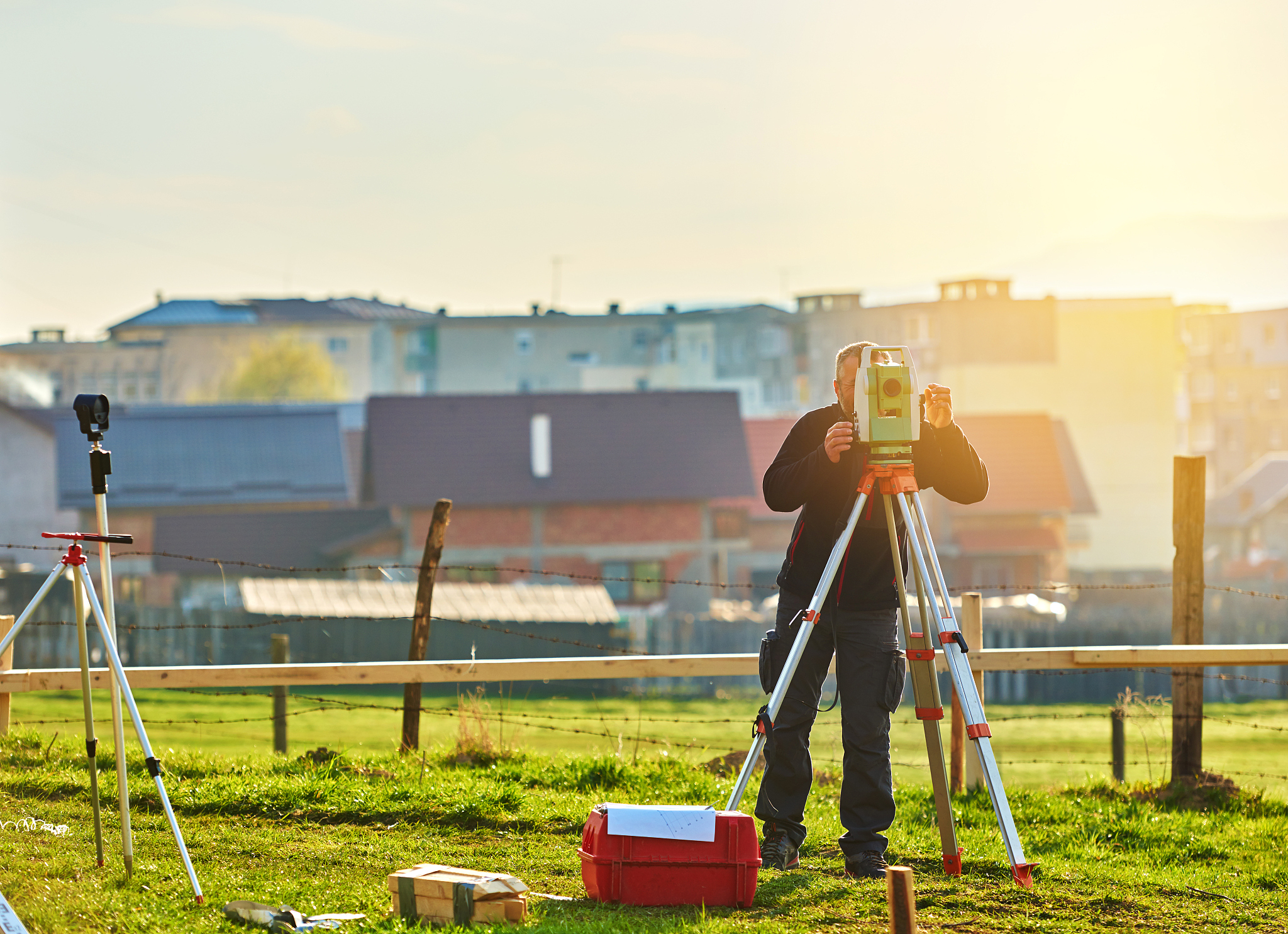 land surveyor with total station