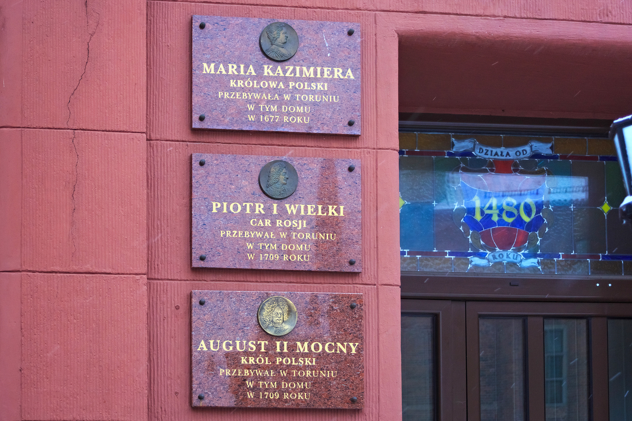 fragment of old building in torun where historical figures staye