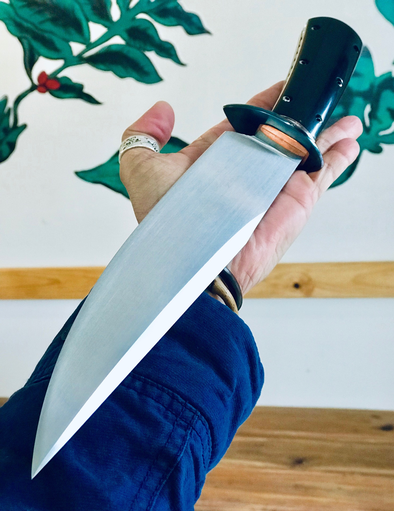 cropped hand of man holding knife