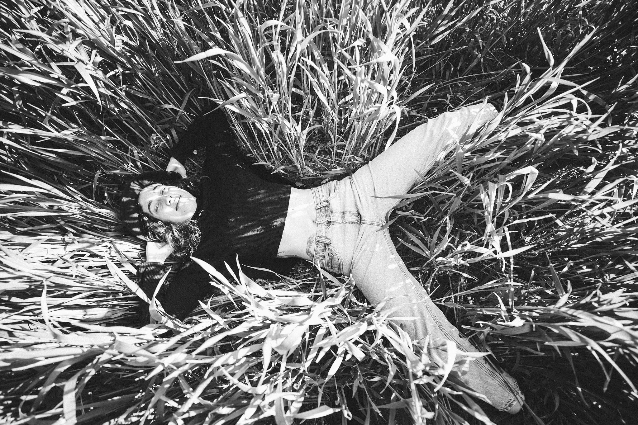 directly above shot of woman lying on field