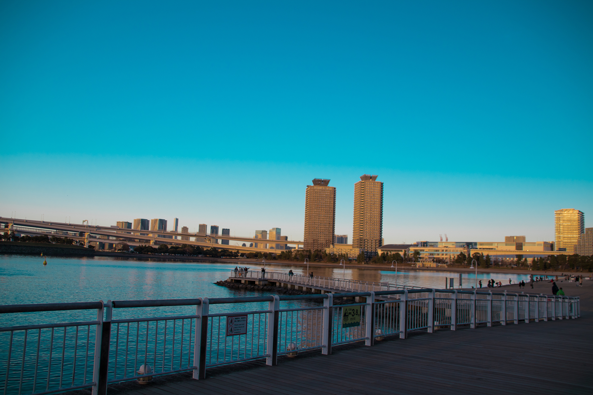 river by buildings against clear blue sky