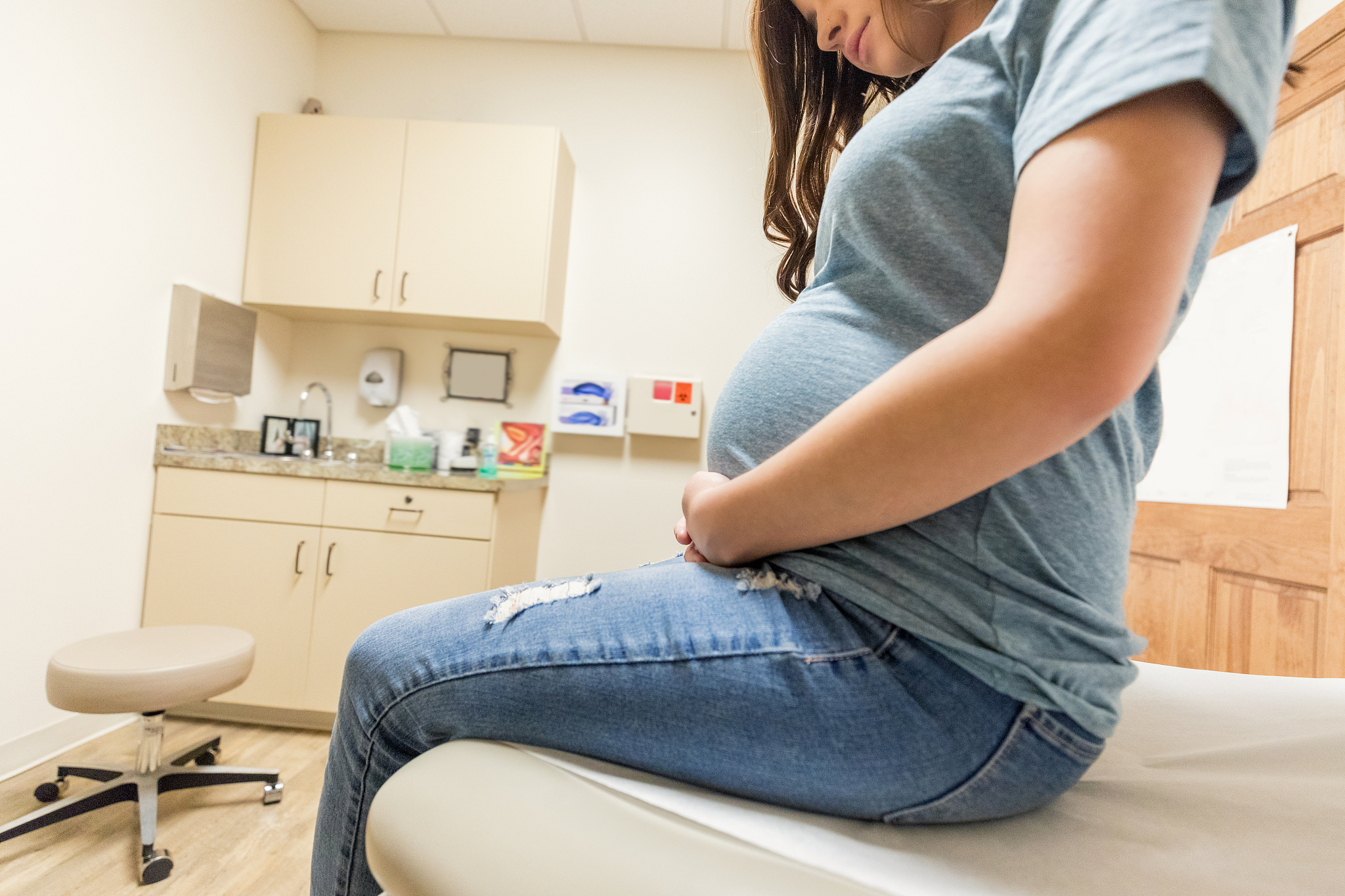 expectant new mom in obstetrician's office