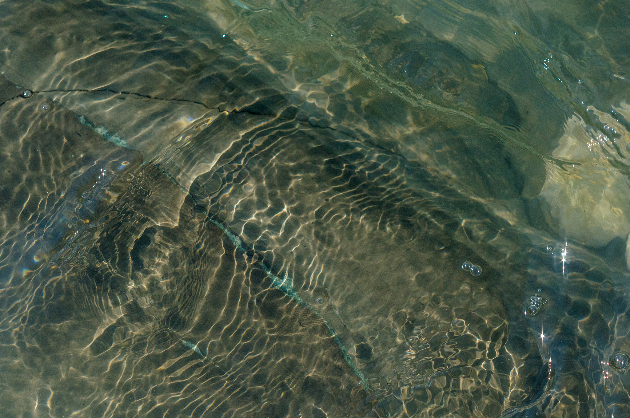 pebble stones on the sea beach, the rolling waves of the sea wit