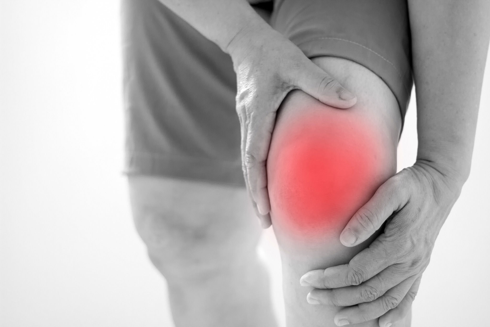 soft focus of old asian women to knee injury on white background
