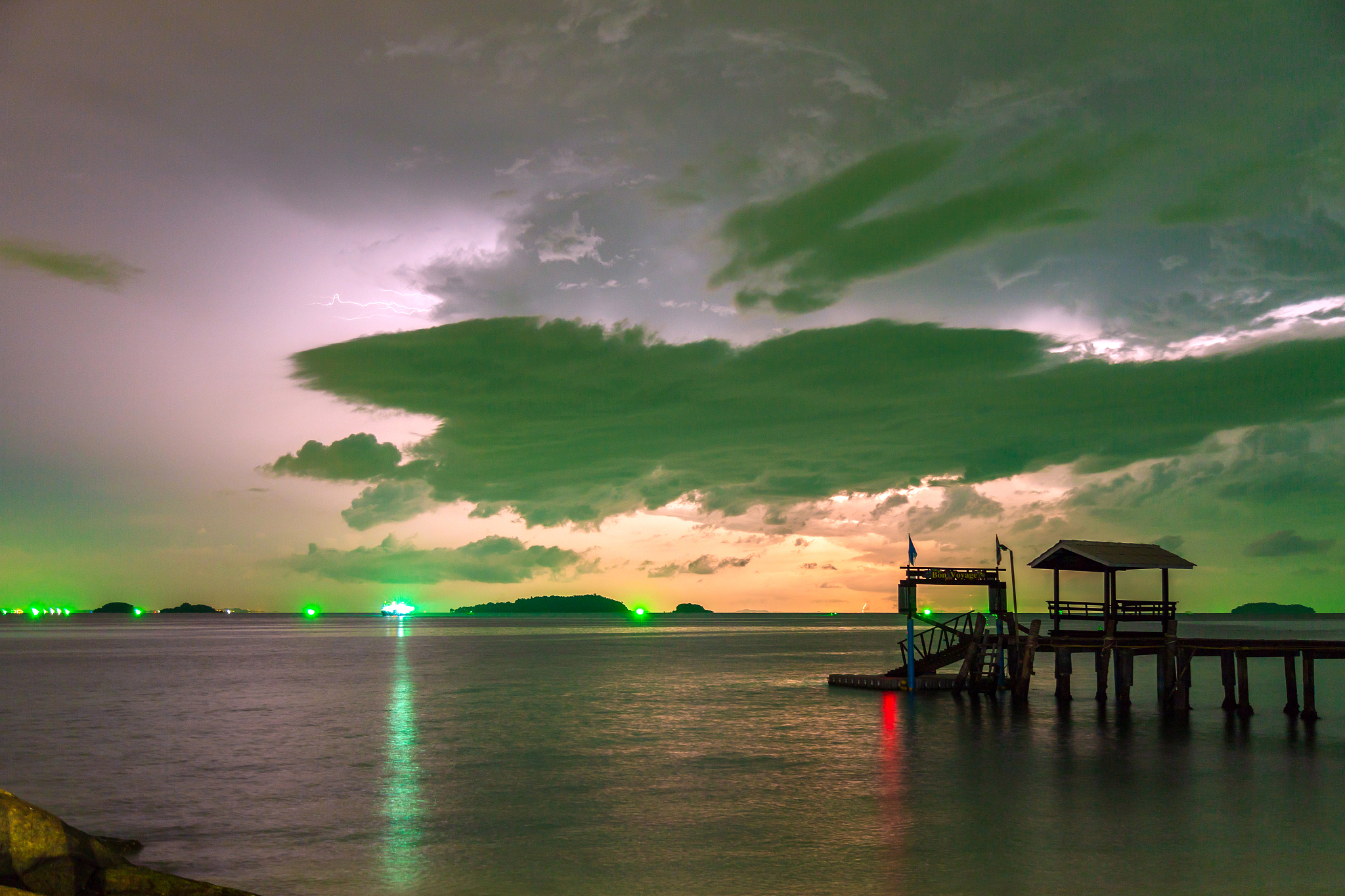 a night picture of pavilion on the sea in stormy night