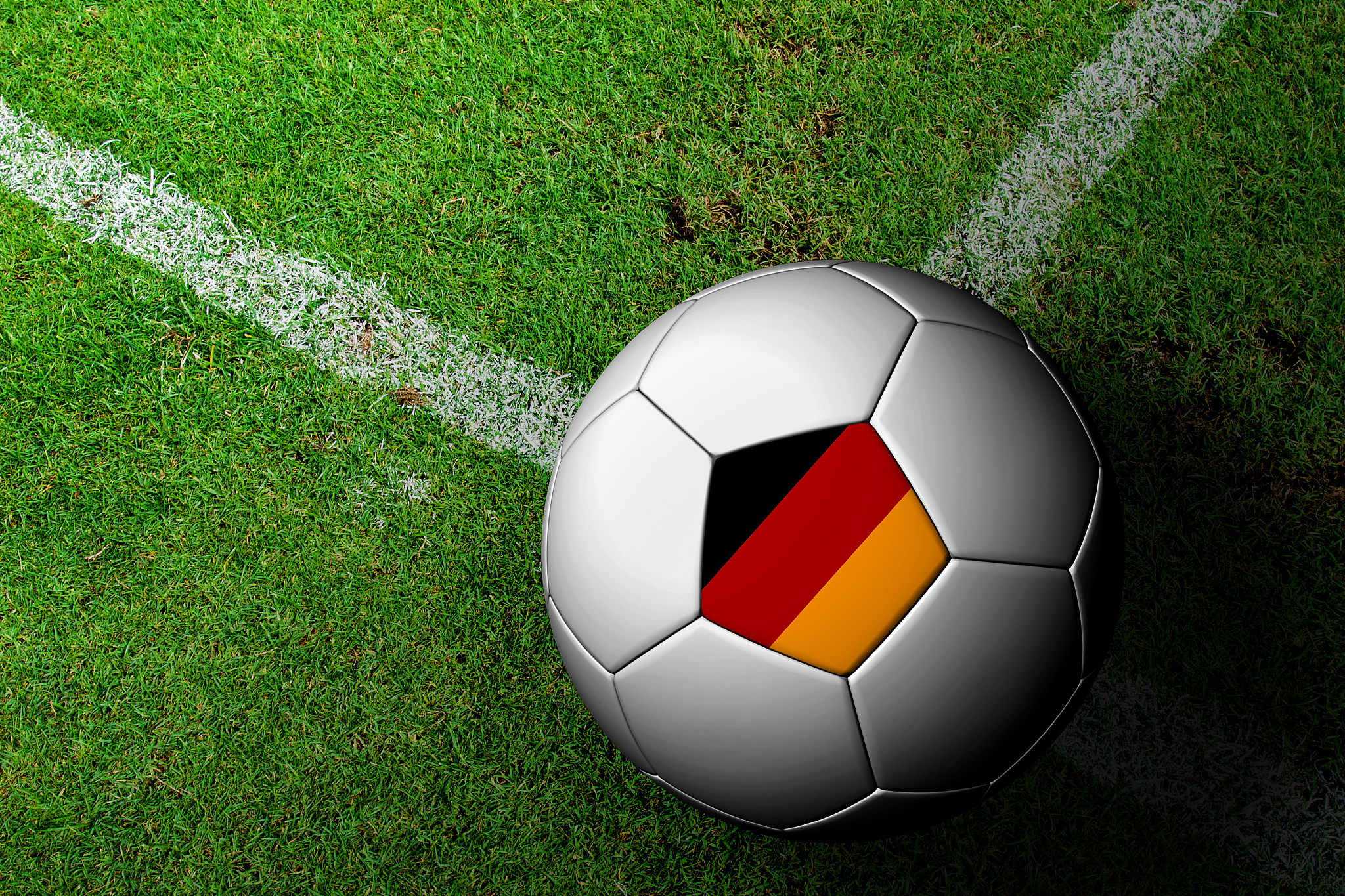 germany flag pattern of a soccer ball in green grass