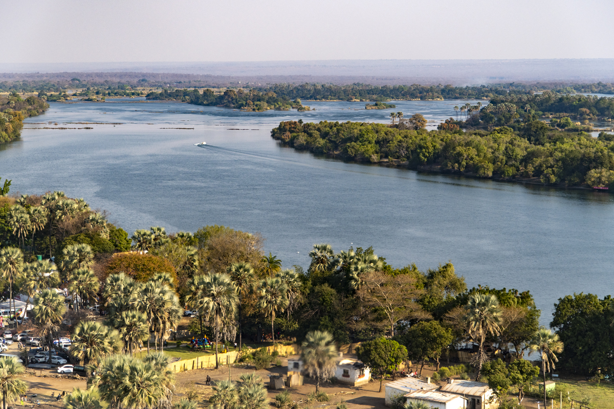 将下面文字翻译成英文本文主要利用Landsat8卫星影像数据采用遥感技术对鄱阳湖区域的生态环境进行了分析。通过使用slope函数分析植被覆盖度和植被健康指数变化观测鄱阳湖区域水体面积的变化情况以及利用植被指数NDVI与地表温度LST构建TVDI模型分析干旱时空分布特征以及变化趋势。本文的研究结果如下：首先从2022年7月到10月鄱阳湖区域的植被覆盖度除了原鄱阳湖水体区域呈现增加的趋势其他区域的植被