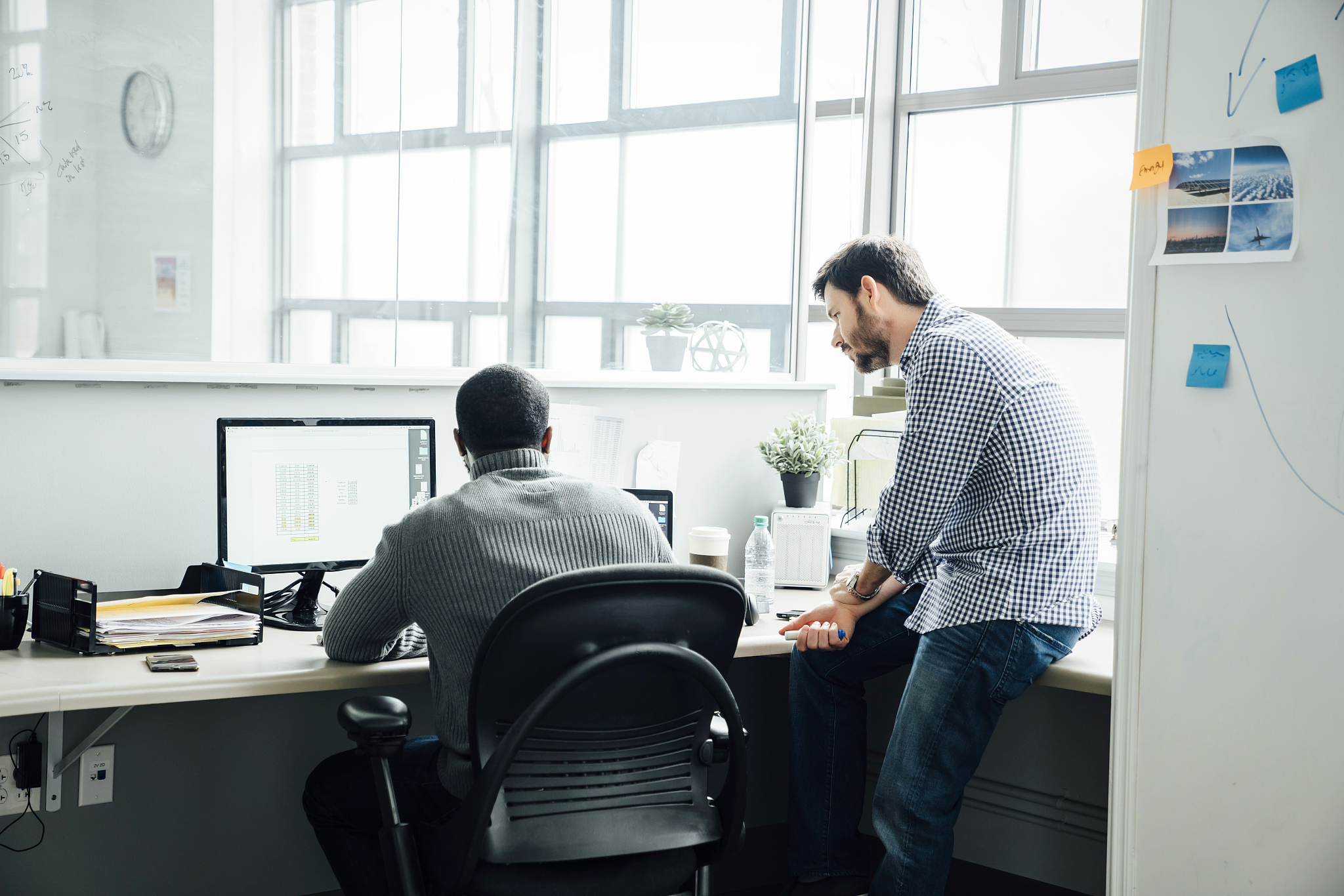 men using computer in office