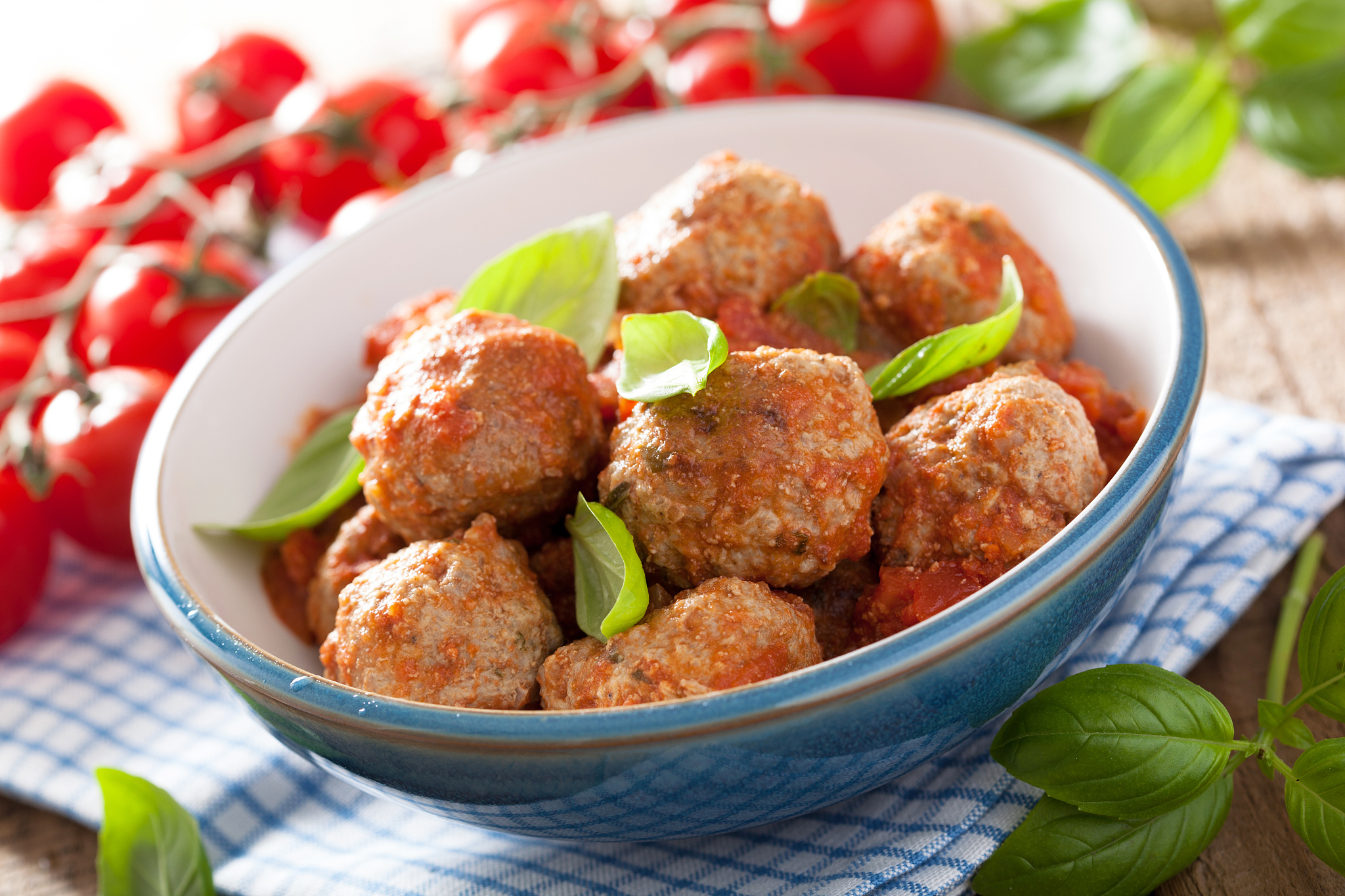 meatballs with tomato sauce in blue bowl
