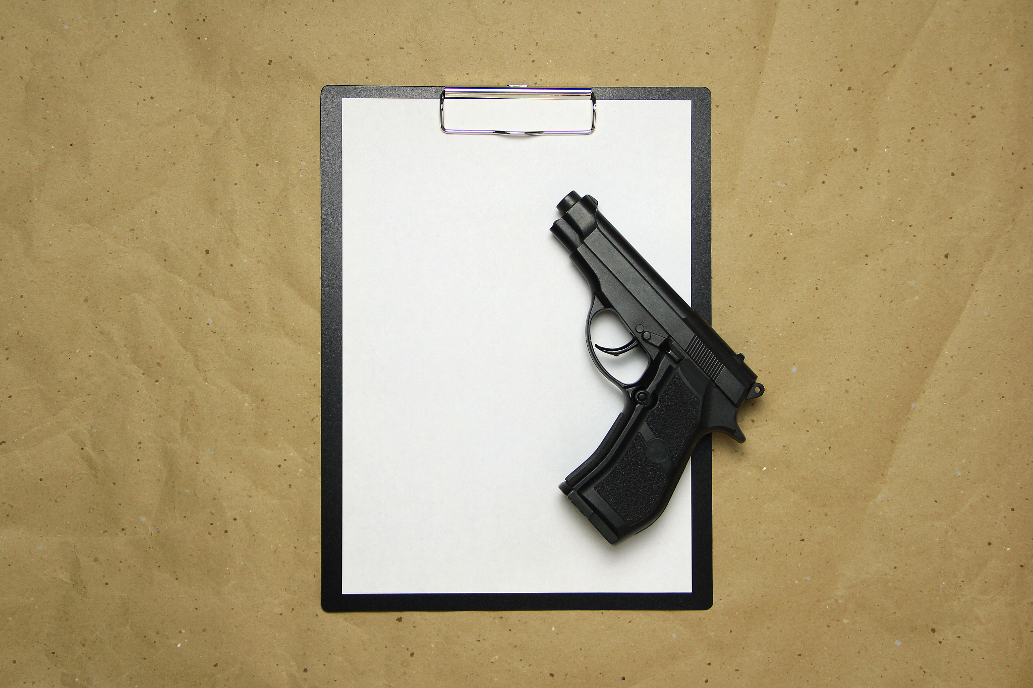 a tablet with a white sheet of a4 format on a beige craft paper