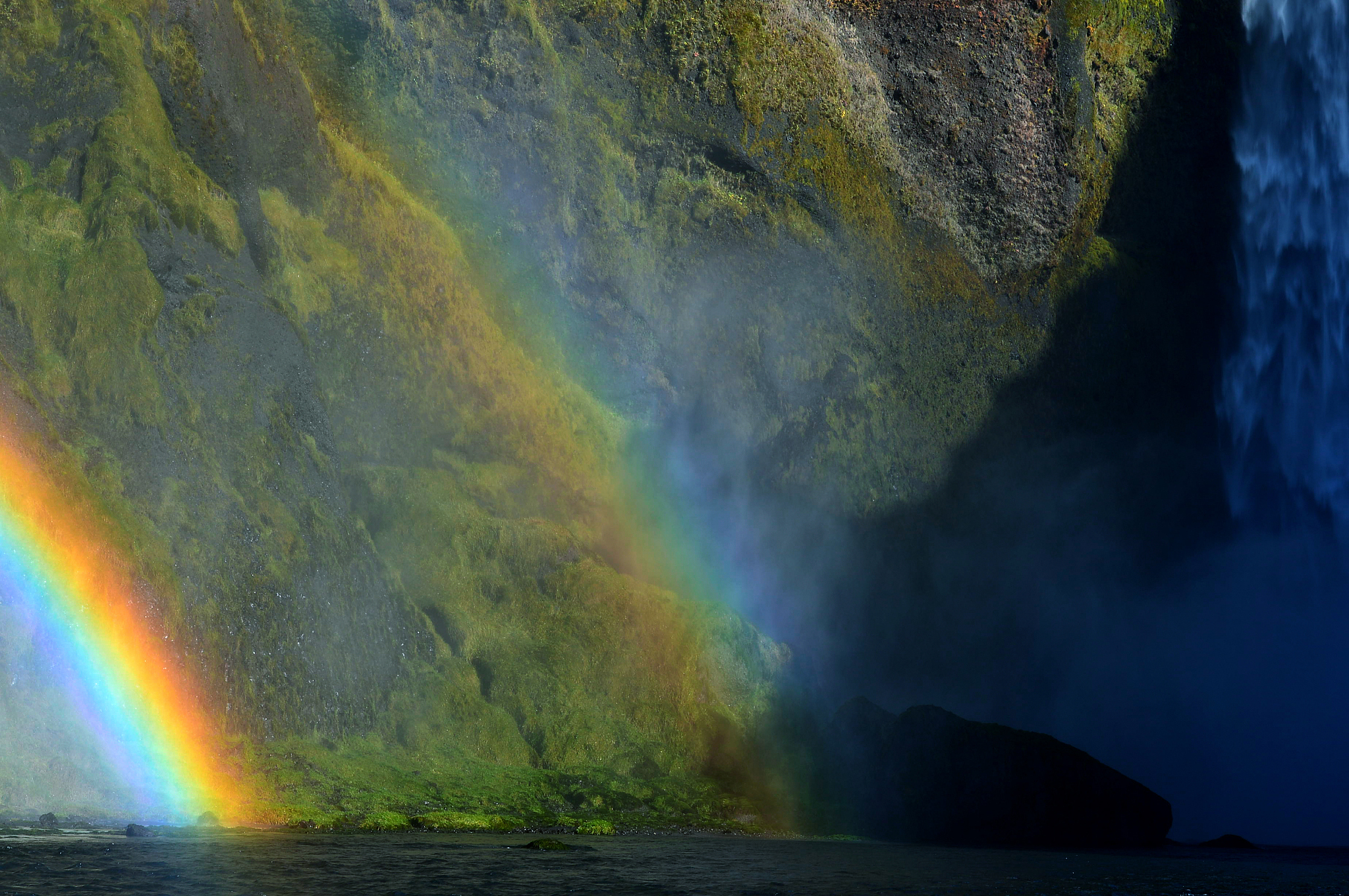 landscape under a full rainbow, landmannalaugar, iceland