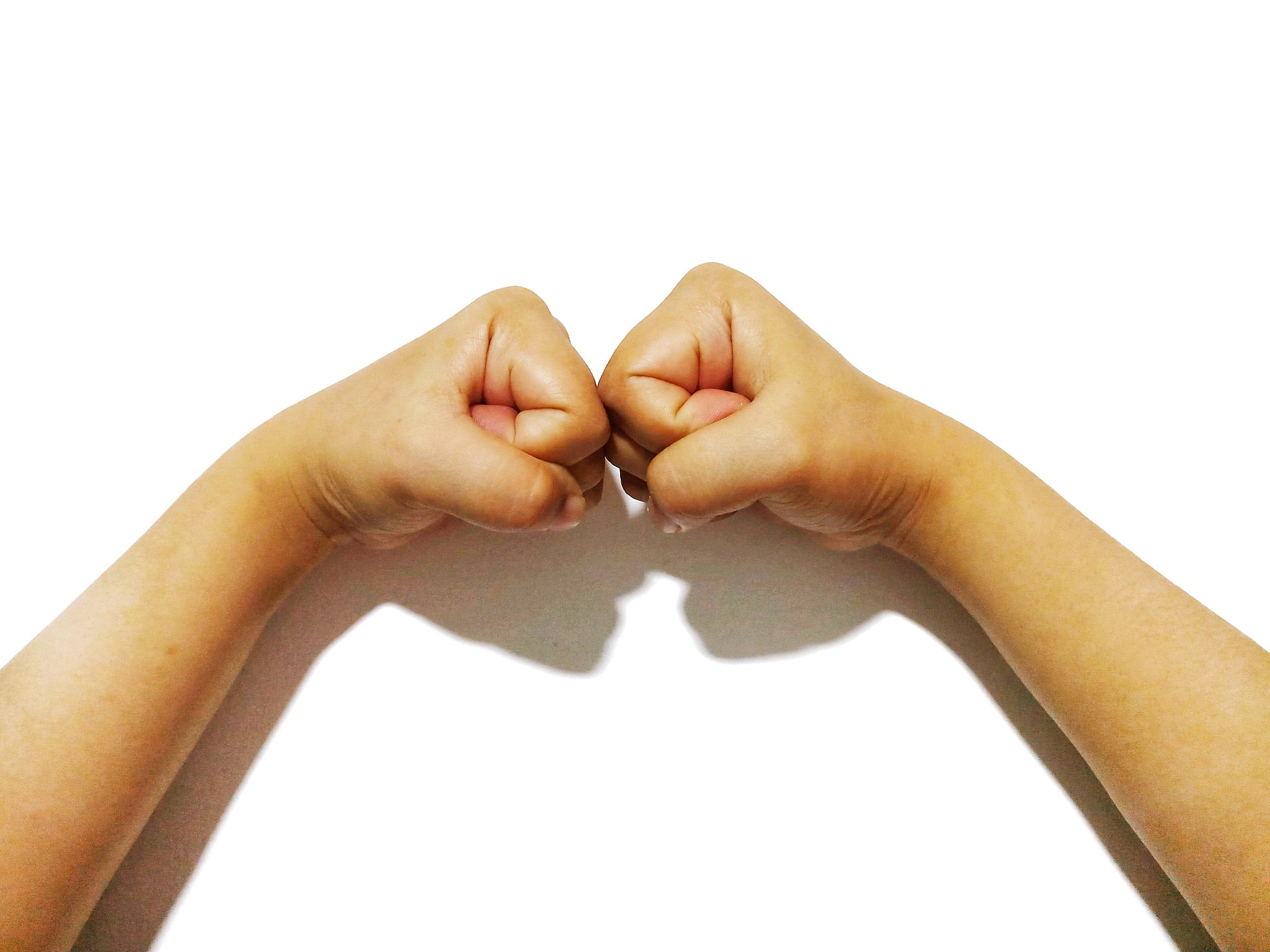 close-up of hands against white background