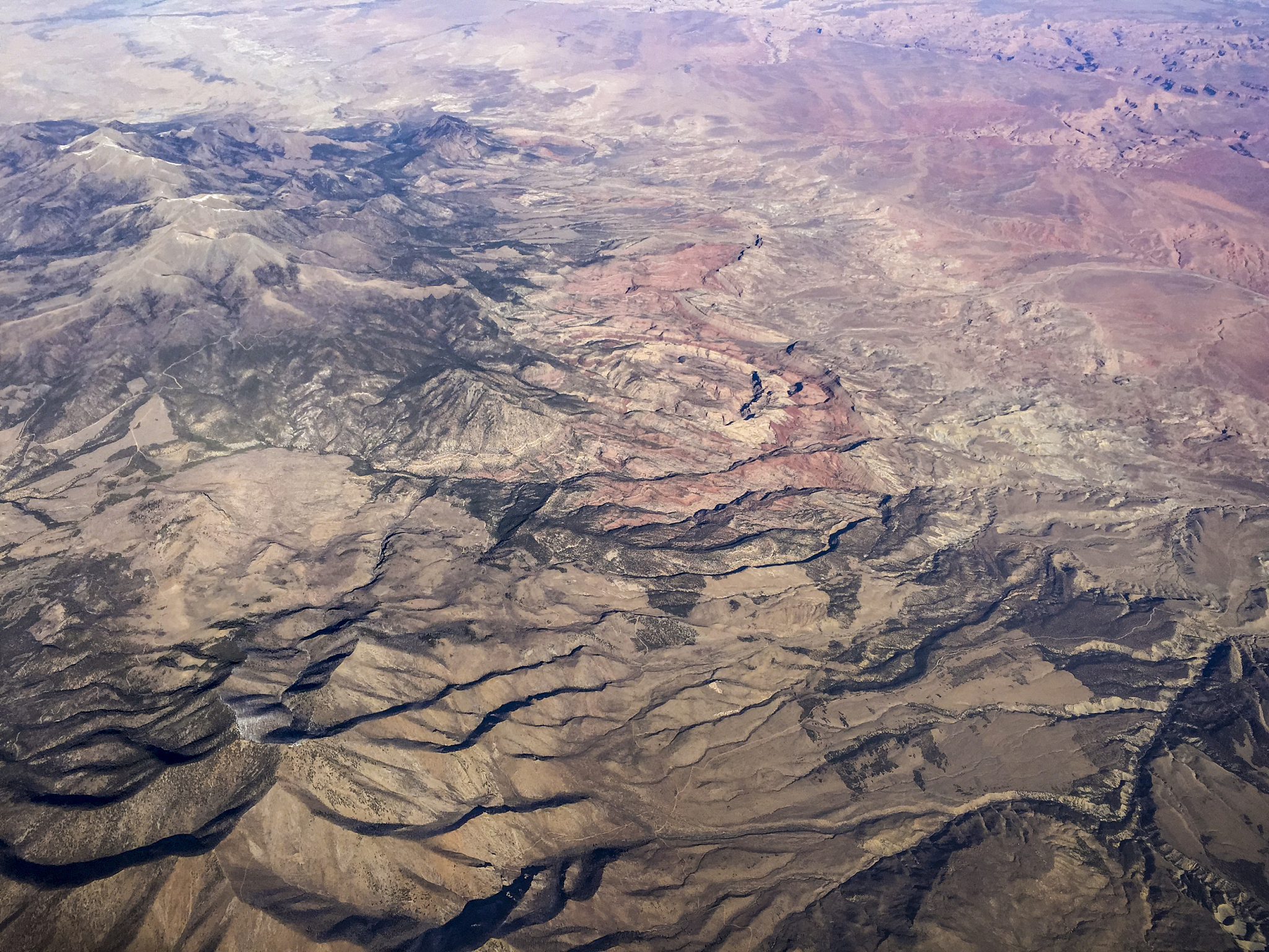 view from the plane window when flying over mountain range, cany