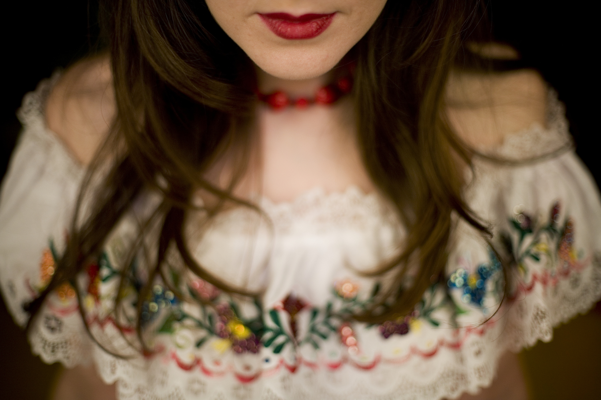 woman wearing embroidered lace top