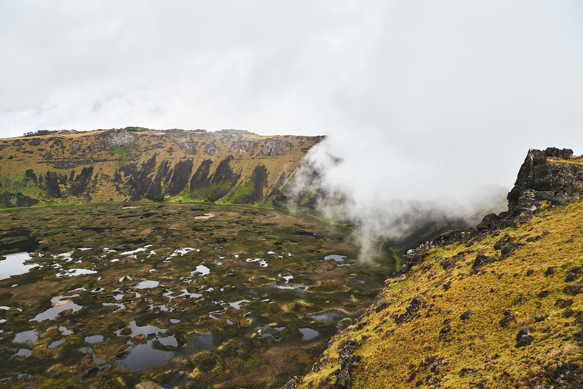 scenic view of volcanic crater against sky