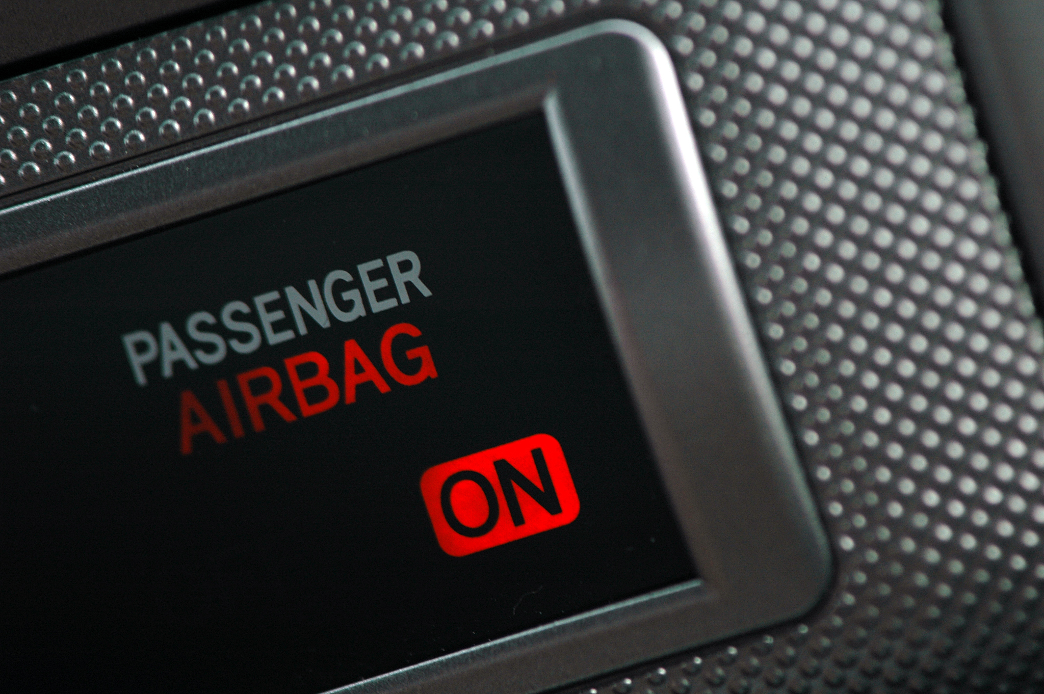 an illuminated display showing an airbag on