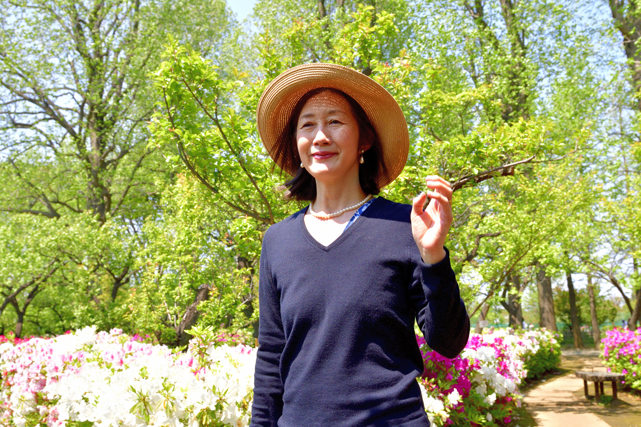 japanese woman enjoying azalea flowers in full bloom at public p