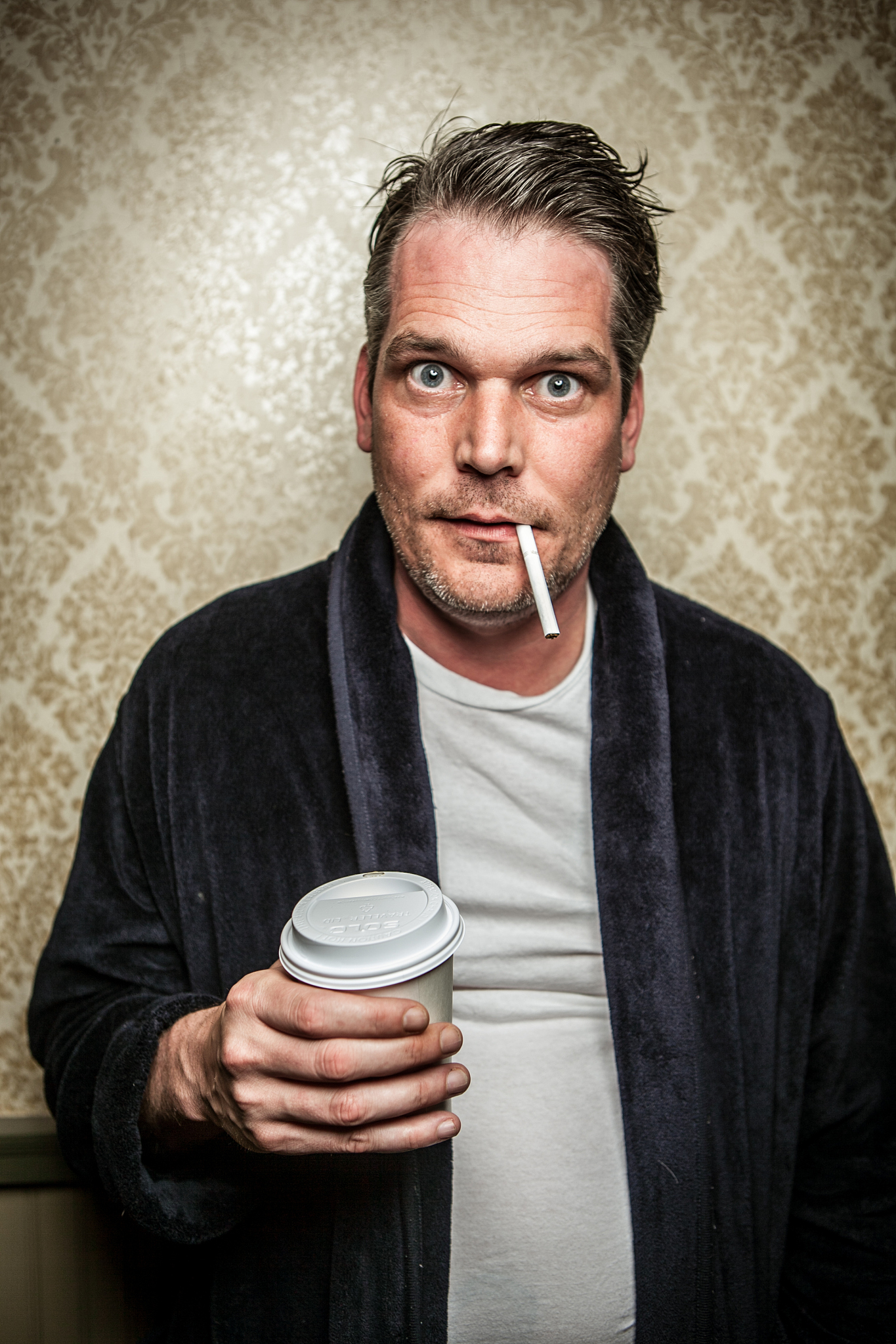 unshaven man  open bathrobe with cigarette, coffee caffeine jitt